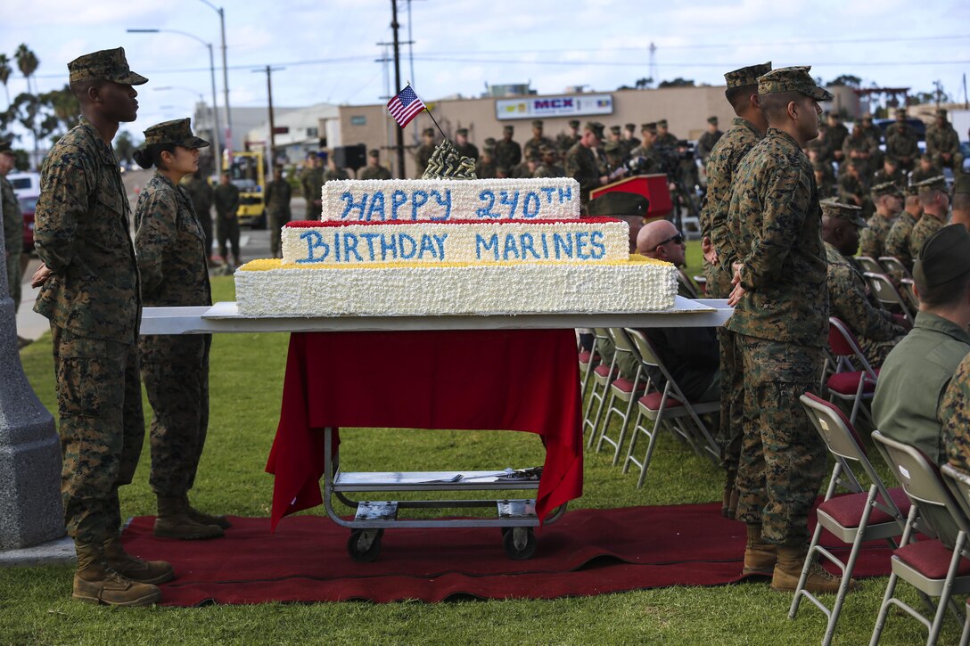 Marines with Marine Corps Air Station Miramar and 3rd Marine Aircraft Wing wait to escort the cake during a cake-cutting ceremony aboard MCAS Miramar, Calif., Nov. 10. The cake cutting ceremony is one of many traditions the Marines use to celebrate the birth of the Marine Corps.