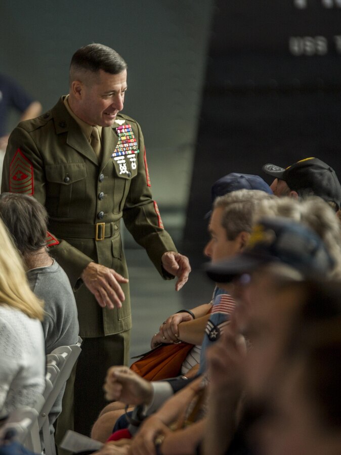 Sgt. Maj. Anthony A. Spadaro, sergeant major of Marine Forces Reserve and Marine Forces North, greets veterans at the National World War II Museum in New Orleans during a Veterans Day Ceremony, Nov. 11, 2015. Service members and civilians took part in the ceremony to remember those who fought in battles past, and to recognize those who are fighting today. Veterans Day was first celebrated Nov. 11, 1954, to honor veterans who served in all wars. 