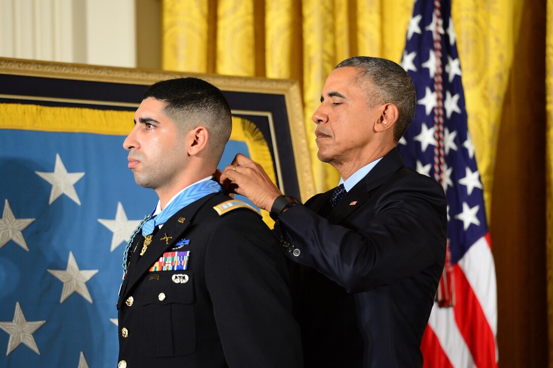 President Barack Obama presents the Medal of Honor to retired Army Capt. Florent A. Groberg during a ceremony at the White House, Nov. 12, 2015. Groberg received the medal for actions during a combat engagement in Kunar province, Afghanistan, Aug. 8, 2012, while he was the commander of a personal security detail for the 4th Brigade Combat Team, 4th Infantry Division. He and another soldier, Army Sgt. Andrew Mahoney, identified and tackled a suicide bomber, saving the lives of the brigade commander and several others. U.S. Army photo by Eboni L. Everson-Myart
