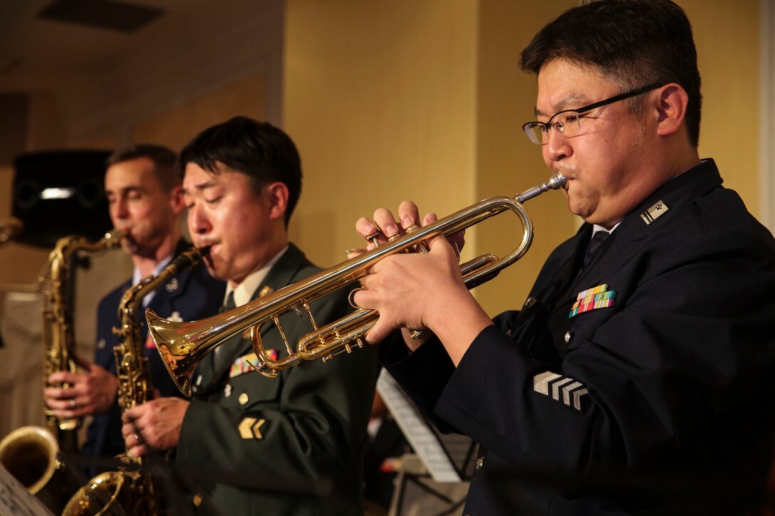 Band members from the U.S. Air Force, Japan Self-Defense Force and Republic of Korea Armed Forces perform together at a reception welcoming the members of all the bands participating in the JSDF Marching Band Festival Nov. 10 in Tokyo, Japan. The festival is a way of sharing military culture and music between partner nations in the Asia-Pacific region.