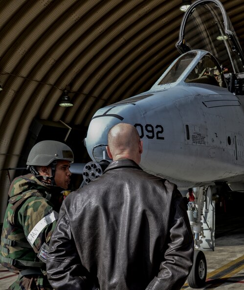 Tech. Sgt. Skylar Derouen, 51st Munitions Squadron munitions equipment assistant section chief, explains his wartime duty as a munitions expediter to Maj. Gen. James N. Post III, Headquarters Air Force director of current operations and deputy chief of staff for operations, while at Osan Air Base, Republic of Korea, Nov. 12, 2015. In a wartime scenario, a munitions expediter ensures the correct munitions are delivered to the right aircraft in a timely manner. Post visited Osan to discuss the challenges Airmen may face with training and readiness at the most forward, non-deployed air bases in the world. As the director of current operations, Post is in charge of providing time-sensitive situational awareness and analysis to Air Force senior leaders and linking worldwide operations with core Air Force processes to enable global vigilance, reach and power. (U.S. Air Force photo/Tech. Sgt. Travis Edwards)