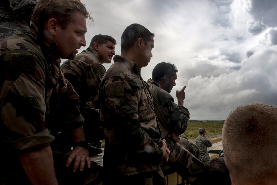 Members of the French air force observe a capabilities demonstration put on by No. 15 Squadron Royal Air Force Regiment during exercise GLOBAL EAGLE, Oct. 21, 2015, at Avon Park Air Force Range, Fla. During the live fire demonstration, the RAF Regiment used tactical movements and dismounted techniques not commonly used by U.S. forces. (U.S. Air Force photo by Senior Airman Ryan Callaghan/Released)

