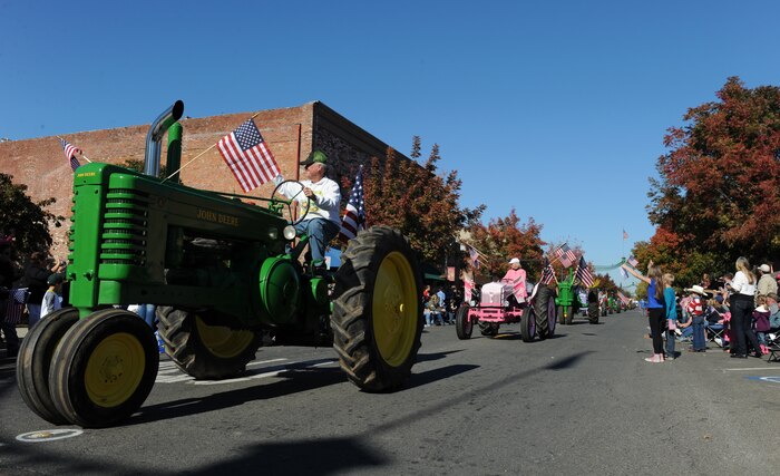 Local farmers ride vintage tractors during the Yuba/Sutter Veterans Day Parade in Marysville, California, Nov. 11, 2015. The local counties have a rich history in agriculture. (U.S. Air Force photo by Staff Sgt. Robert M. Trujillo/Released)


