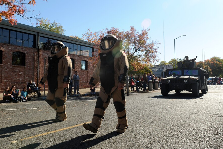 Members of the 9th Civil Engineer Squadron, Explosive Ordnance Disposal team, display protective suits during the Yuba/Sutter Veterans Day Parade in Marysville, California, Nov. 11, 2015. Veterans Day is celebrated throughout the U.S. to honor those who have served and are serving in the Armed Forces. (U.S. Air Force photo by Staff Sgt. Robert M. Trujillo)