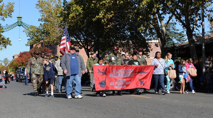 Members of the Blackbird Maintainers Group march during the Yuba/Sutter Veterans Day Parade in Marysville, California, Nov. 11, 2015. The SR-71 Blackbird called Beale Air Force Base home from 1966 to 1990. (U.S. Air Force photo by Staff Sgt. Robert M. Trujillo/Released)
