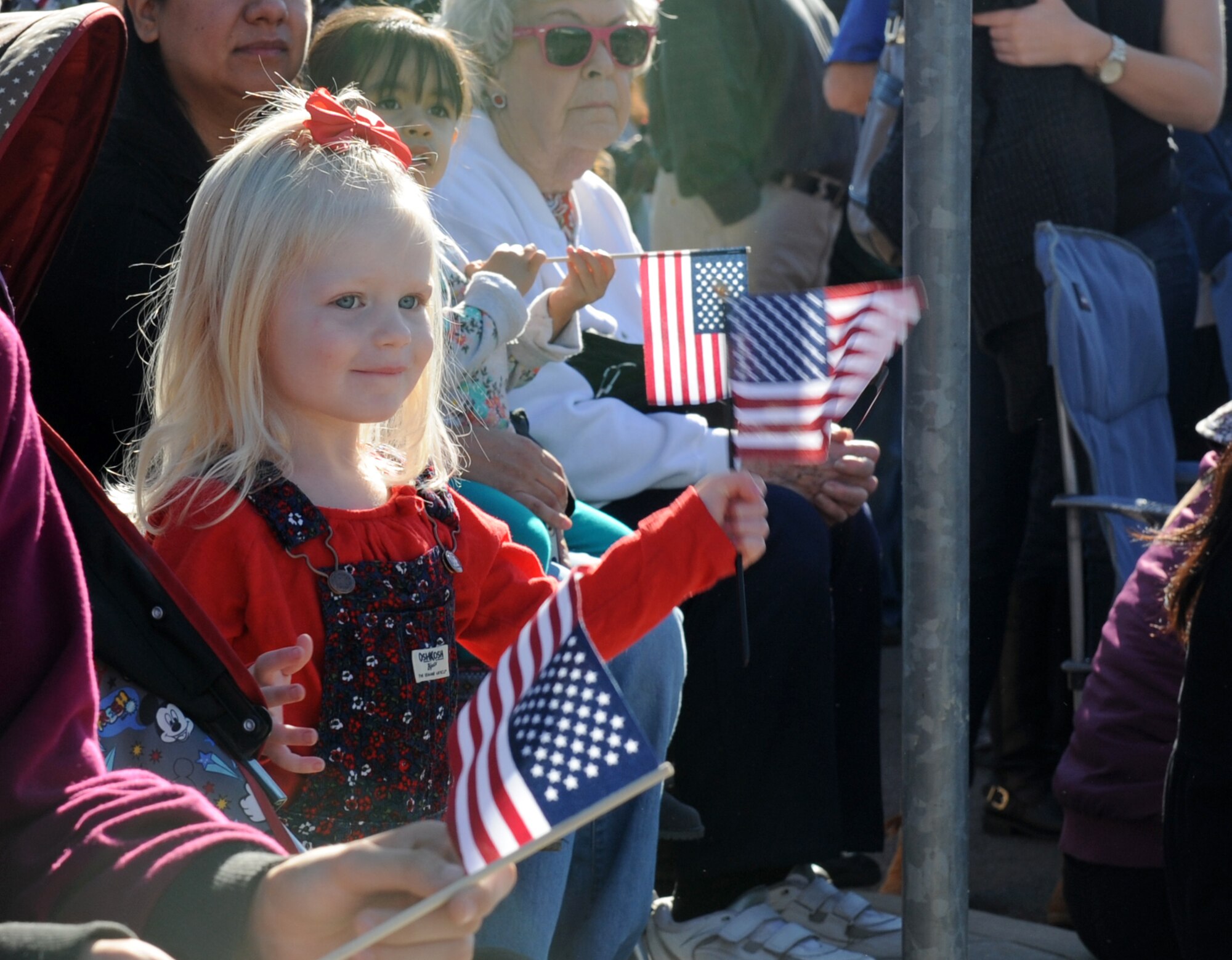 Spectators watch the Yuba/Sutter Veterans Day Parade in Marysville, California, Nov. 11, 2015. Veterans Day is celebrated throughout the U.S. to honor those who have served and are serving in the Armed Forces. (U.S. Air Force photo by Staff Sgt. Robert M. Trujillo)