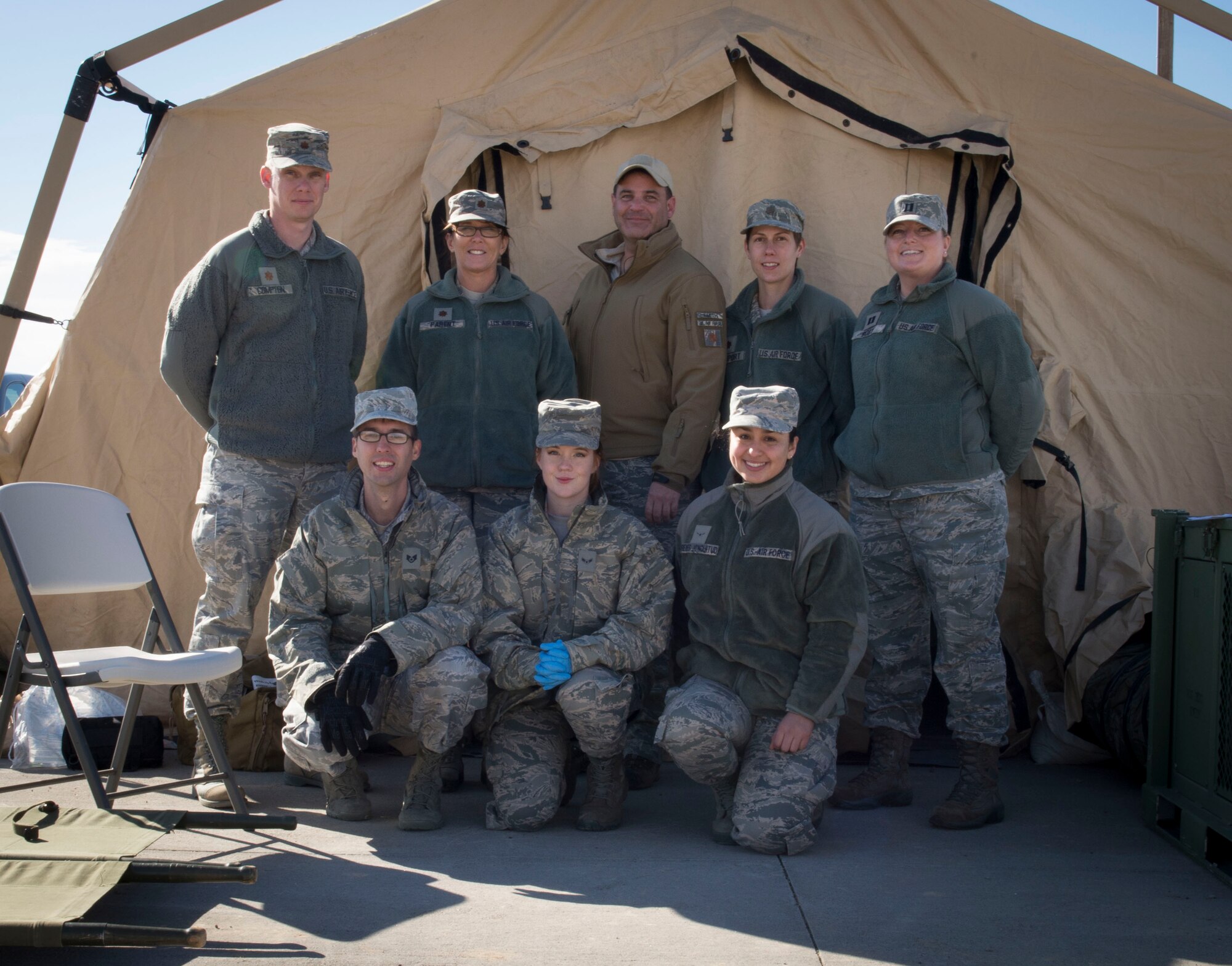 A surgical team poses for a group photo at Mountain Home Air Force Base, Idaho, Nov. 5, 2015. The surgical team included guardsmen from Fairchild AFB, Washington. They participated in Gunfighter Flag 16-1 exercise to train realistically for deployment missions. (U.S. Air Force photo by Airman 1st Class Jessica H. Evans/RELEASED)