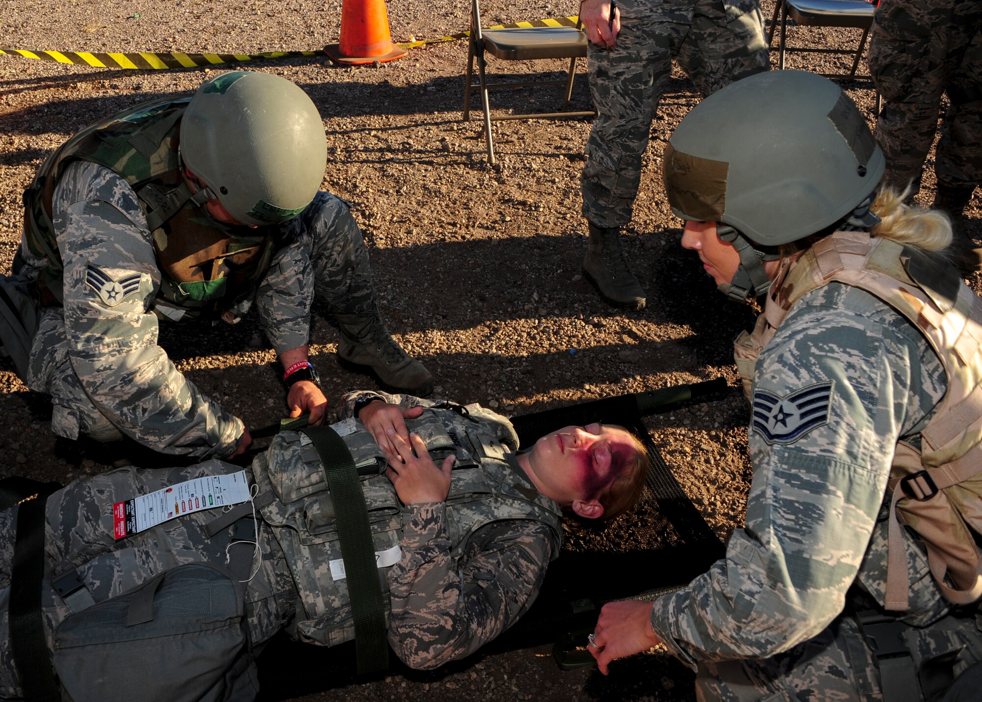 U.S.  Air Force Airman 1st Class Caitlin Obee, 355th Security Forces Squadron defender, acts as a simulated patient with fatal wounds during Exercise BUSHWHACKER 15-07 at Davis-Monthan Air Force Base, Ariz., Nov. 5, 2015. During the exercise, Obee and other Airmen acted as patients and used moulage to create a realistic experience, allowing medical Airmen to perceive the wounds they were treating. (U.S. Air Force photo by Airman Basic Nathan H. Barbour/Released)