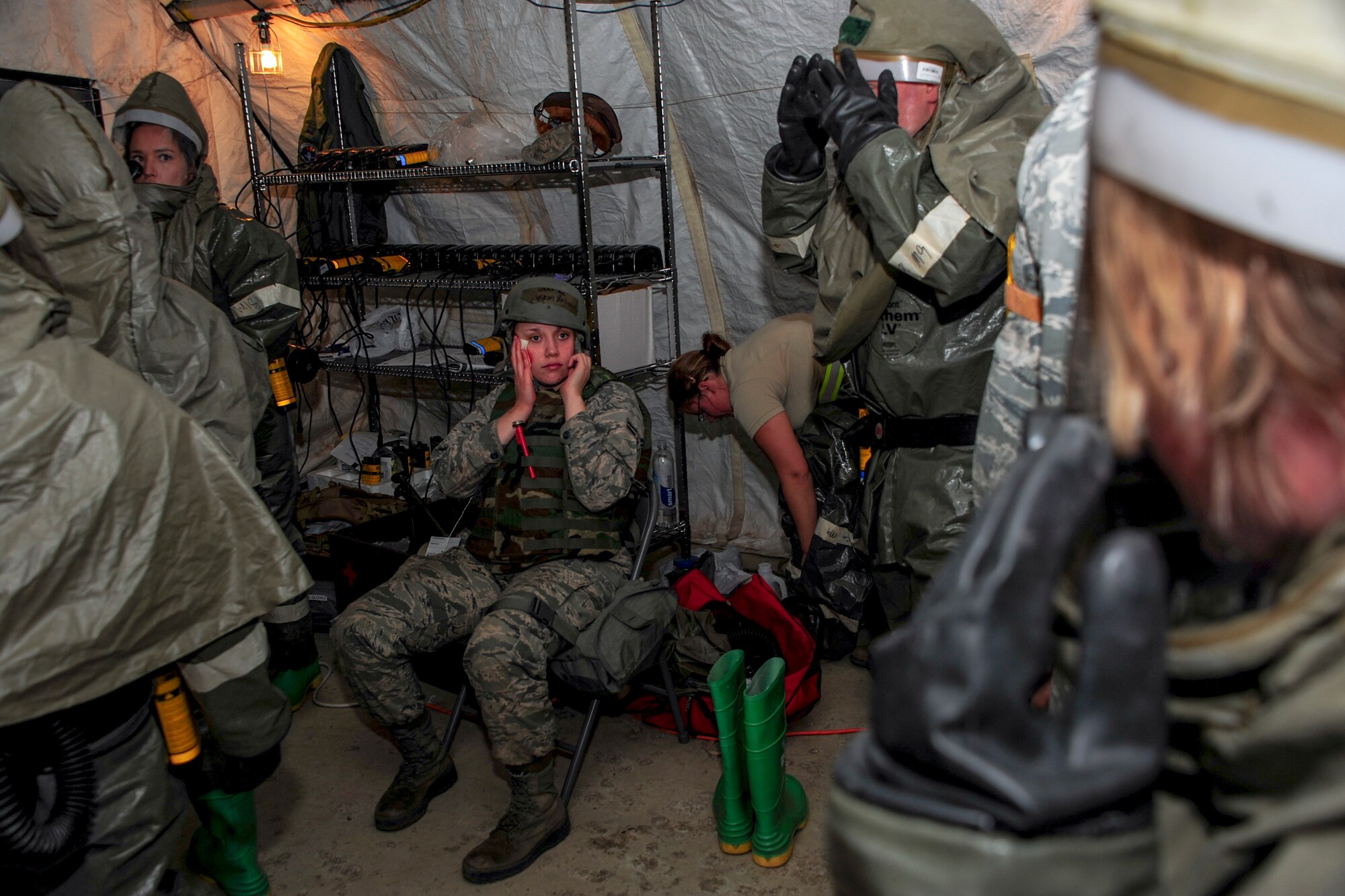 U.S. Air Force Airman 1st Class Allison Bekaert, 355th Force Support Squadron food services apprentice, sits in the medical tent after a simulated attack during Exercise BUSHWHACKER 15-07 at Davis-Monthan Air Force Base, Ariz., Nov. 5, 2015. During the exercise, Bekaert and other Airmen acted as patients and used moulage to create a realistic experience, allowing medical Airmen to perceive the wounds they were treating. (U.S. Air Force photo by Airman Basic Nathan H. Barbour/Released) 