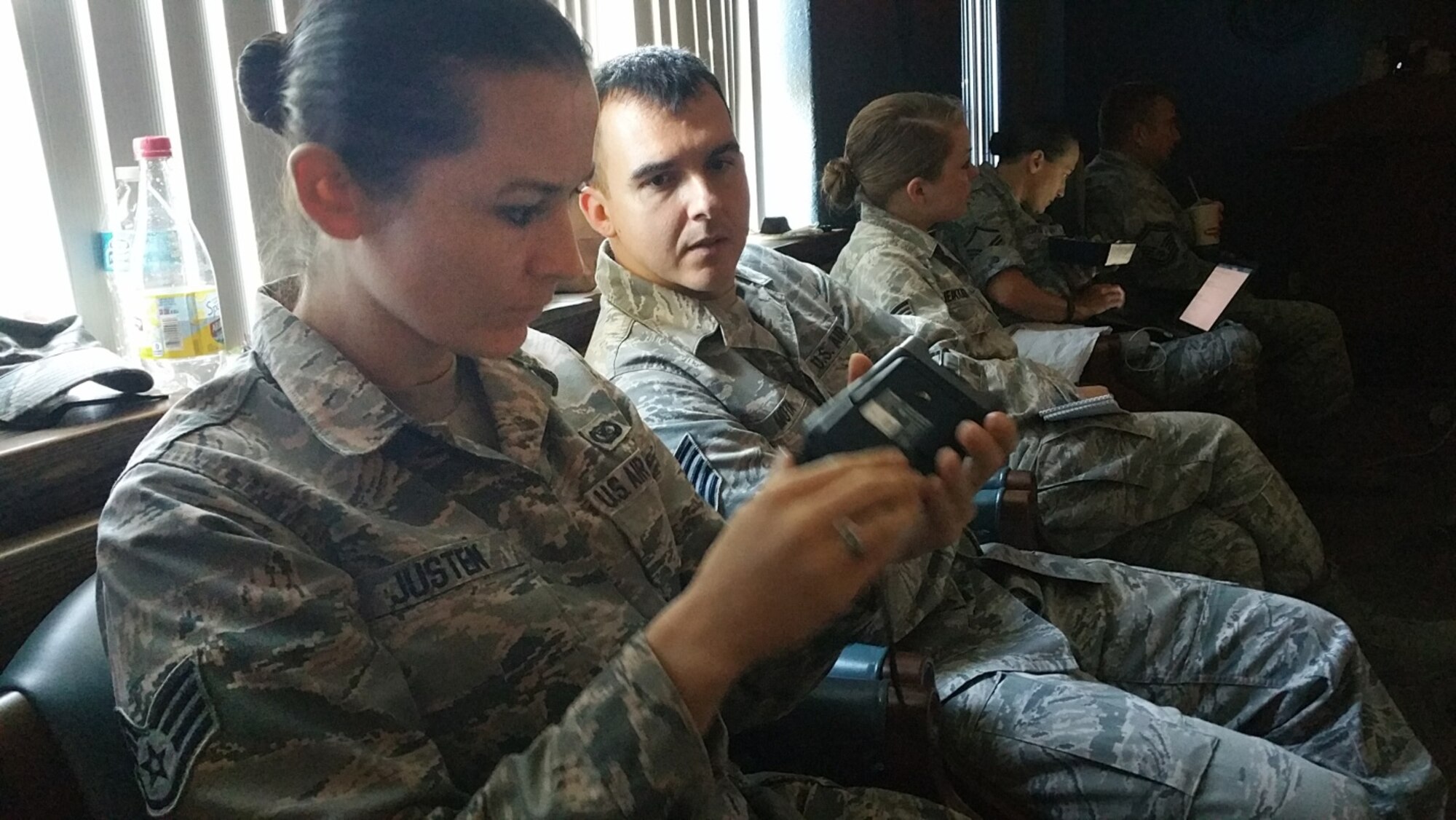 Staff Sgt. Katie Justen, 459th Air Refueling Wing public affairs, Joint Base Andrews, Maryland, and Tech Sgt. Benjamin Mota, 434th Air Refueling Wing public affairs, Grissom Air Reserve Base, Indiana, take a look at new Canon technology at the Fourth Air Force Public Affairs Conference held at March Air Reserve Base, California, on Nov. 3-5, 2015. Public Affairs officers, enlisted and civilians from across the numbered Air Force, as well as their Air National Guard counterparts, attended the conference to network, share best practices, and discuss ways to overcome obstacles in the PA career field. (U.S. Air National Guard photo/Master Sgt. Julie Avey)