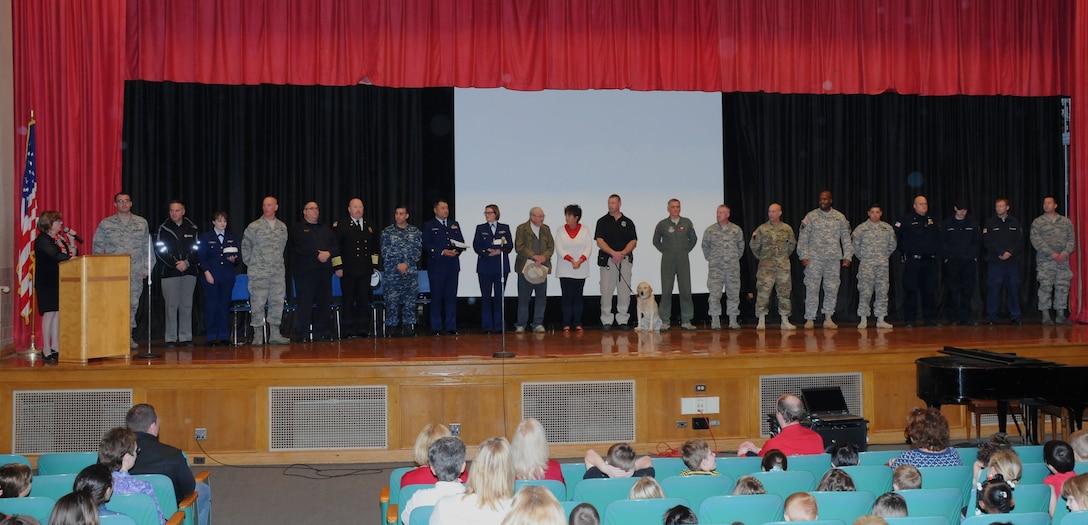 Military personnel from the Western New York community attend an assembly at Hoover Elementary School in Tonawanda N.Y. on Nov. 9, 2015. Various elementary schools held activities which allowed personnel from the Niagara Falls Air Reserve Station to read with students and share some of their experiences as a member of the Armed Forces. (U.S. Air Force photo by Staff Sgt. Matthew Burke)