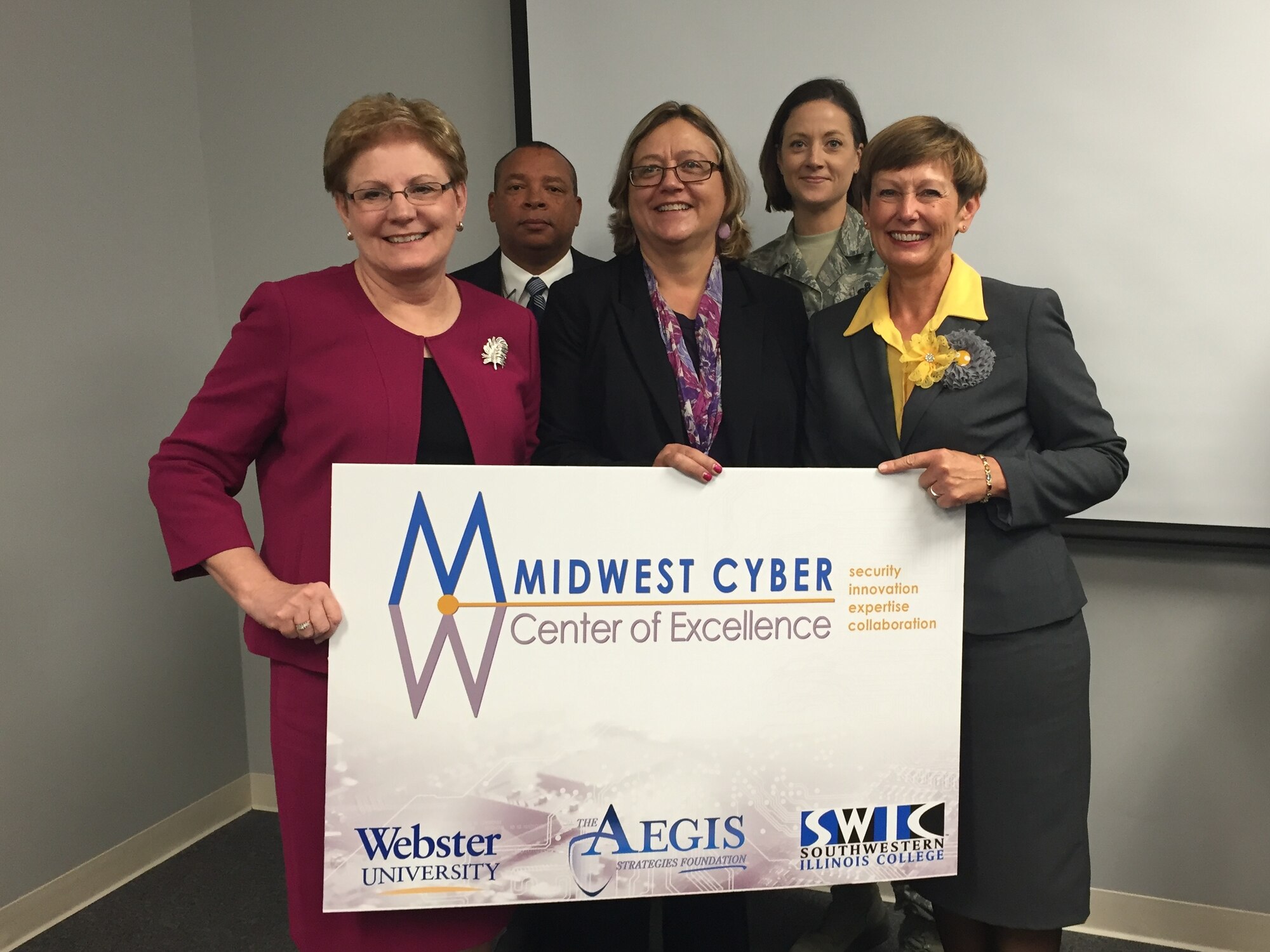 The Midwest Cyber Center of Excellence holds a press conference Oct. 27 with partners to include Scott Air Force Base, the Leadership Council Southwestern Illinois and Southwestern Illinois College. From left to right: Janet Fontenot, Ed.D., Dean of Business Division at Southwestern Illinois College; Col Sam Douglas, USAF Retired; Donna Davis, 375 Communications Group Technical Director; Senior Master Sgt. Diane Slazinik, 375th Communications Support Squadron Air Force Cyber Control Center Flight Chief; and Ellen Krohne, Leadership Council Southwestern Illinois Executive Director. (Photo courtesy of Midwest Cyber Center of Excellence)