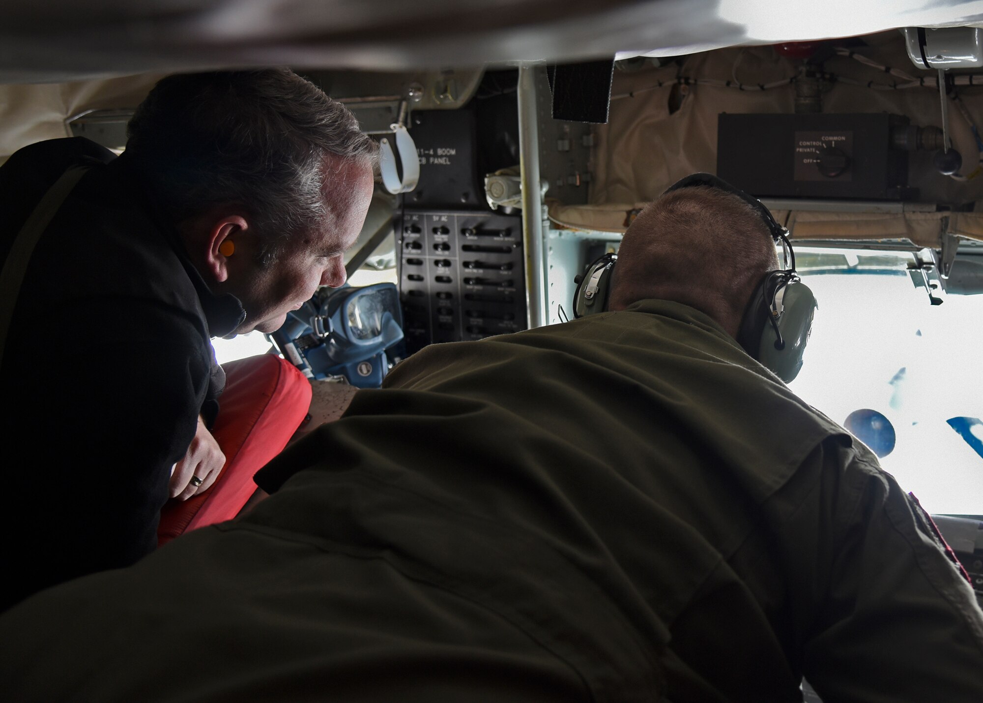 David Condon, Mayor of Spokane and 92nd Air Refueling Wing honorary commander, lays in the boom pod beside Staff Sgt. Gregory Albers, 93rd Air Refueling Squadron boom operator, during an orientation flight Nov. 12, 2015, at Fairchild Air Force Base, Wash. The orientation flight gave Spokane-area civic leaders an opportunity to observe the air-refueling mission firsthand.
(U.S. Air Force photo/Airman 1st Class Mackenzie Richardson)
