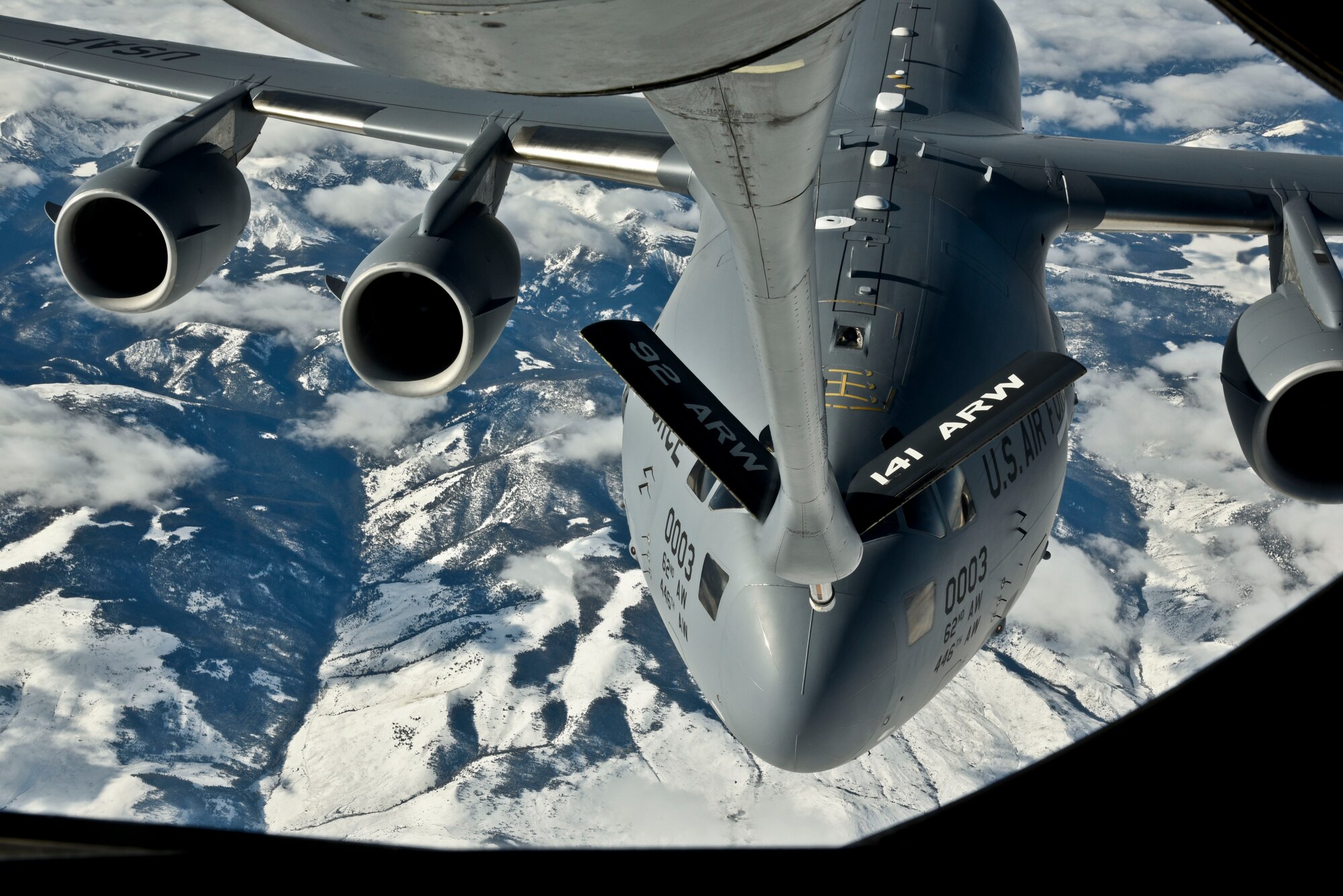A C-17 Globemaster, from Joint-Base Lewis McChord, Wash., receives fuel
from a 92nd Air Refueling Wing KC-135 Stratotanker Nov. 12,
2015, over Washington state. During the flight honorary commanders were able to
lay beside Staff Sgt. Gregory Albers, 93rd Air Refueling Squadron boom
operator, during refueling, as well as view another refueling mission from
the cockpit of a different KC-135 and C-17. (U.S. Air Force photo-Airman 1st
Class Taylor Bourgeous) 
