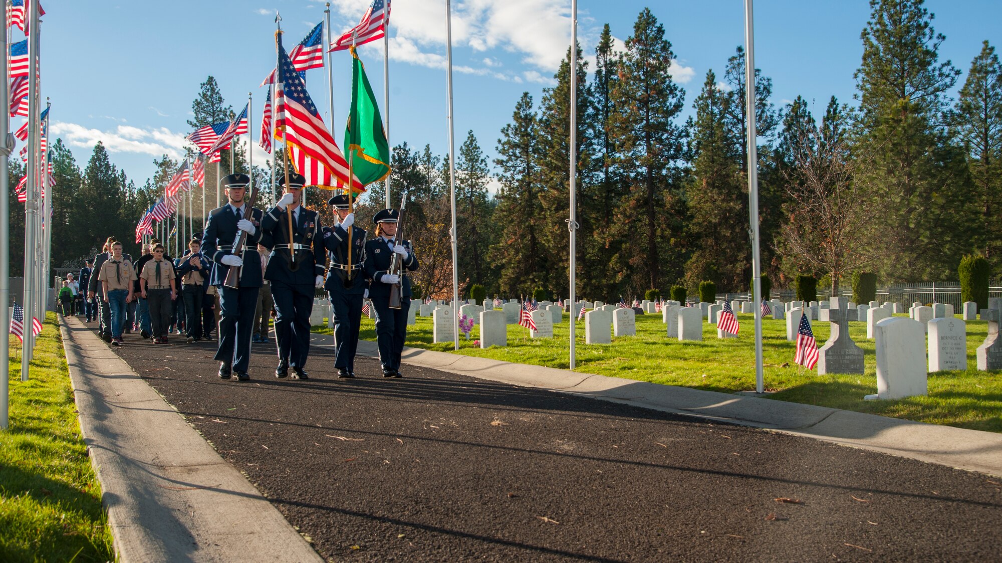 Members of the Fairchild honor guard present the colors during a Veterans Day event Nov. 11, 2015, at the Fort George Wright Cemetery, in Spokane, Wash. The Fort George Wright Cemetery was created in the 1890s to ensure a proper final resting place for those who died while serving in the military. (U.S. Air Force Photo/ Airman 1st Class Sean Campbell)