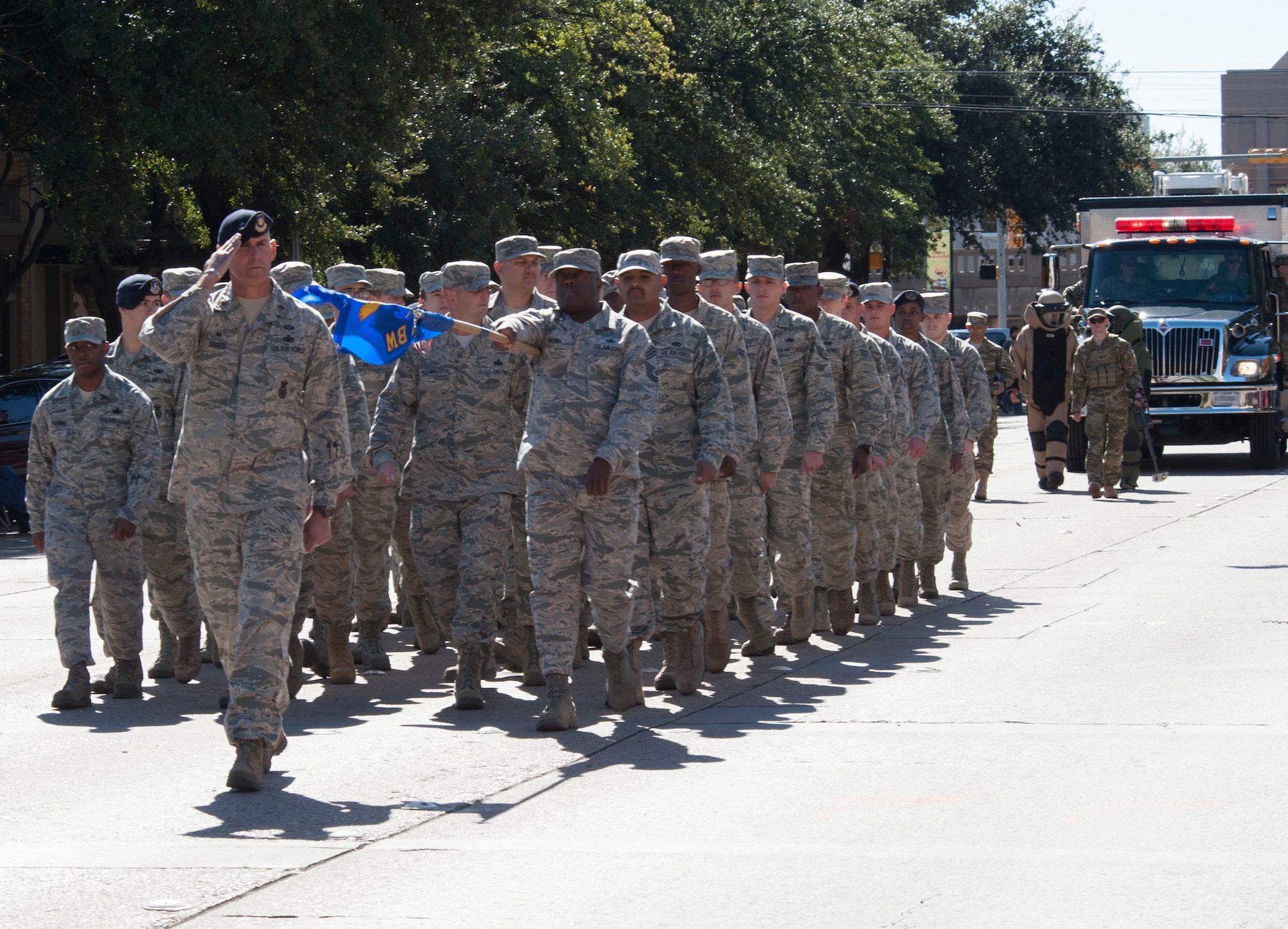U.S. Air Force Airmen from the 7th Security Forces Squadron at Dyess Air Force Base march in formation during the annual Veteran’s Day Parade on Nov. 7, 2015 in downtown Abilene, Texas. The Airmen marched alongside the local community to commemorate the service of all military veterans. (U.S. Air Force Photo by Airman 1st Class Katherine Miller/Released)
