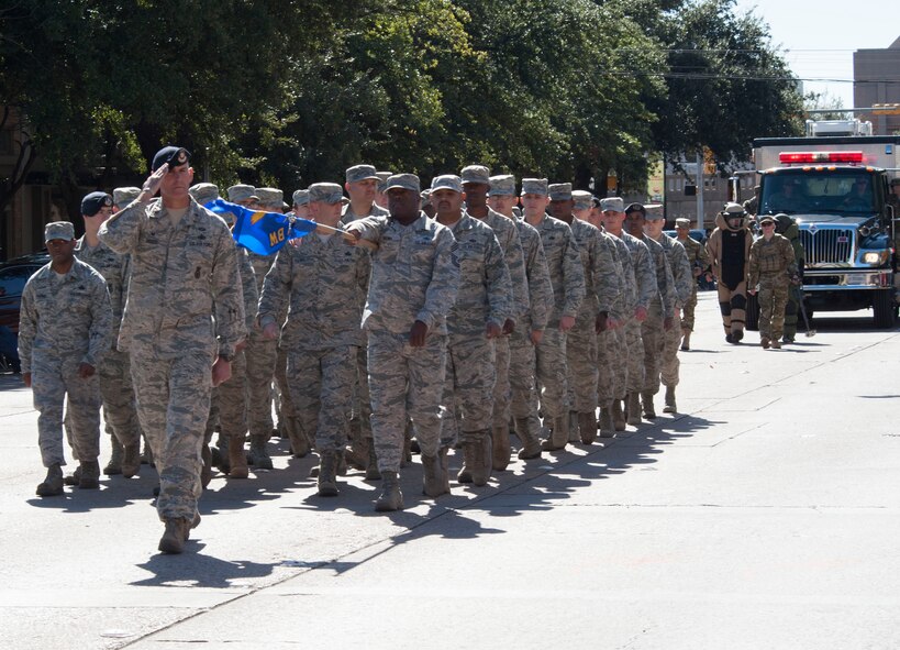 U.S. Air Force Airmen from the 7th Security Forces Squadron at Dyess Air Force Base march in formation during the annual Veterans Day Parade on Nov. 7, 2015 in downtown Abilene, Texas. The Airmen marched alongside the local community to commemorate the service of all military veterans. (U.S. Air Force Photo by Airman 1st Class Katherine Miller/Released) 