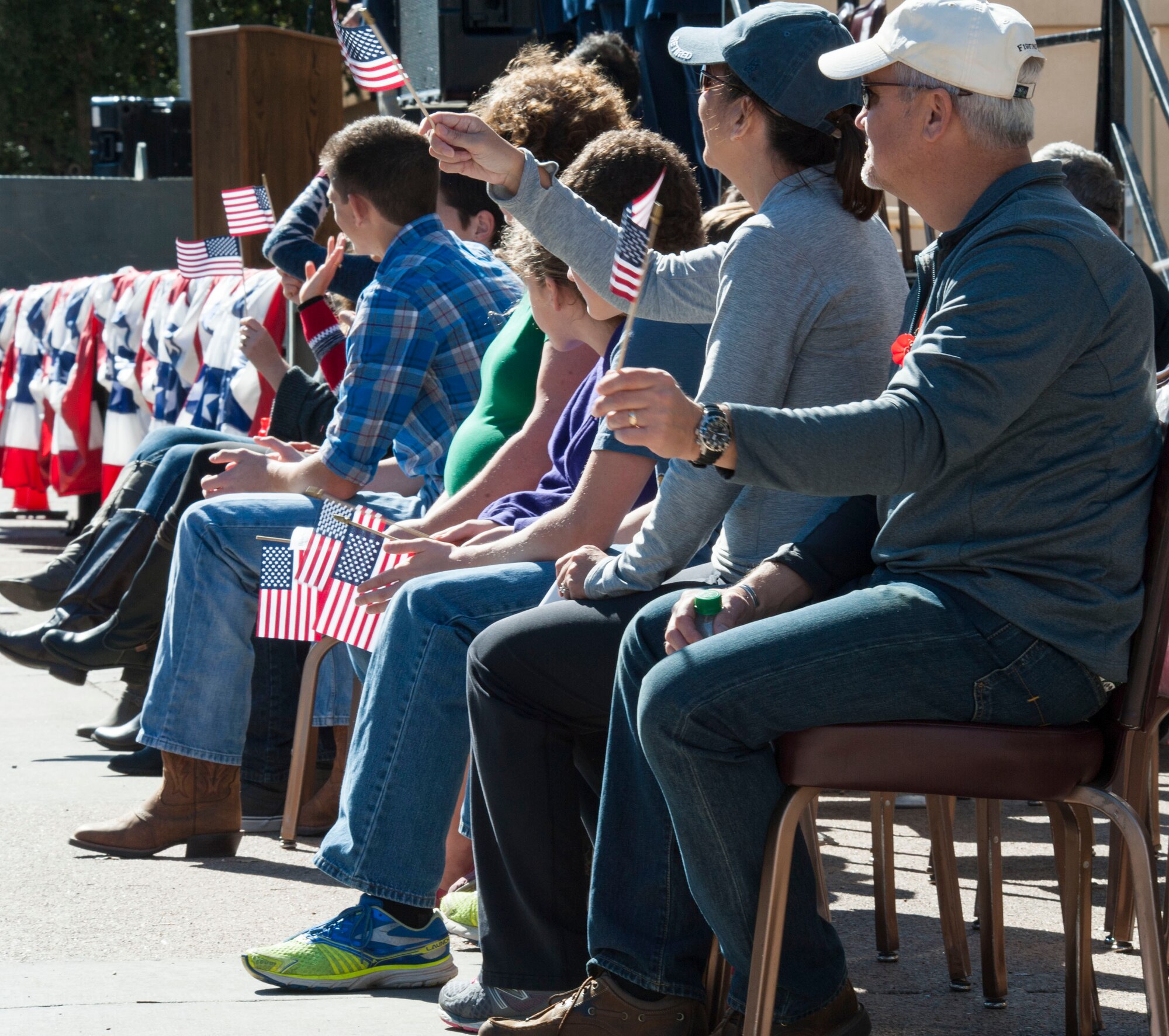Families watch the passing local participants and marching Airmen during the annual Veteran’s Day Parade on Nov. 7, 2015 in downtown Abilene, Texas. Citizens from Abilene and surrounding communities lined the streets to show their appreciation for military members and veterans. (U.S. Air Force Photo by Airman 1st Class Katherine Miller/Released)