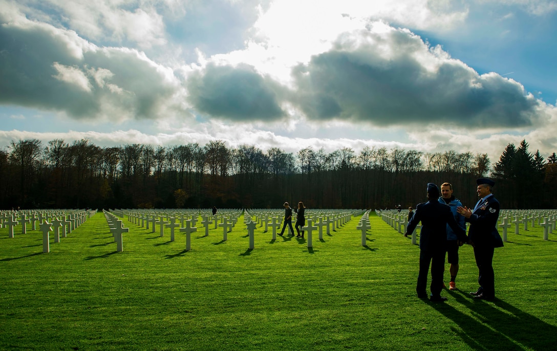 U.S. Air Force service members visit the Luxembourg American Cemetery and Memorial after a wreath-laying ceremony in Hamm, Luxembourg City, Luxembourg, Nov. 11, 2015. The cemetery was established on Dec. 29, 1944 by the 609th Quartermaster Company of the U.S. Third Army in Luxembourg, which served as headquarters for U.S. Army Gen. George Patton, whose headstone was raised there. (U.S. Air Force photo by Airman 1st Class Timothy Kim/Released)