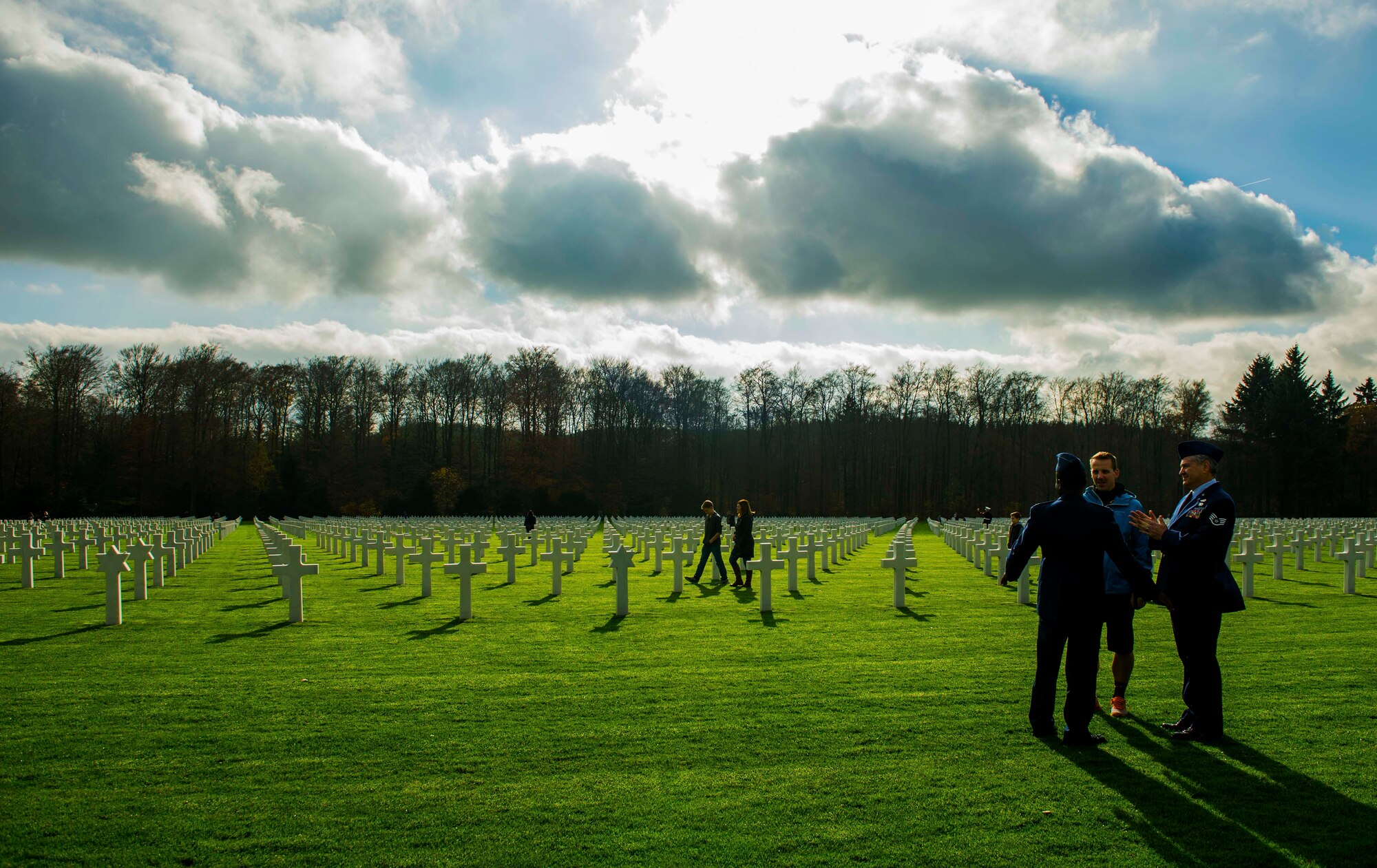 U.S. Air Force service members visit the Luxembourg American Cemetery and Memorial after a wreath-laying ceremony in Hamm, Luxembourg City, Luxembourg, Nov. 11, 2015. The cemetery was established on Dec. 29, 1944 by the 609th Quartermaster Company of the U.S. Third Army in Luxembourg, which served as headquarters for U.S. Army Gen. George Patton, whose headstone was raised there. (U.S. Air Force photo by Airman 1st Class Timothy Kim/Released)