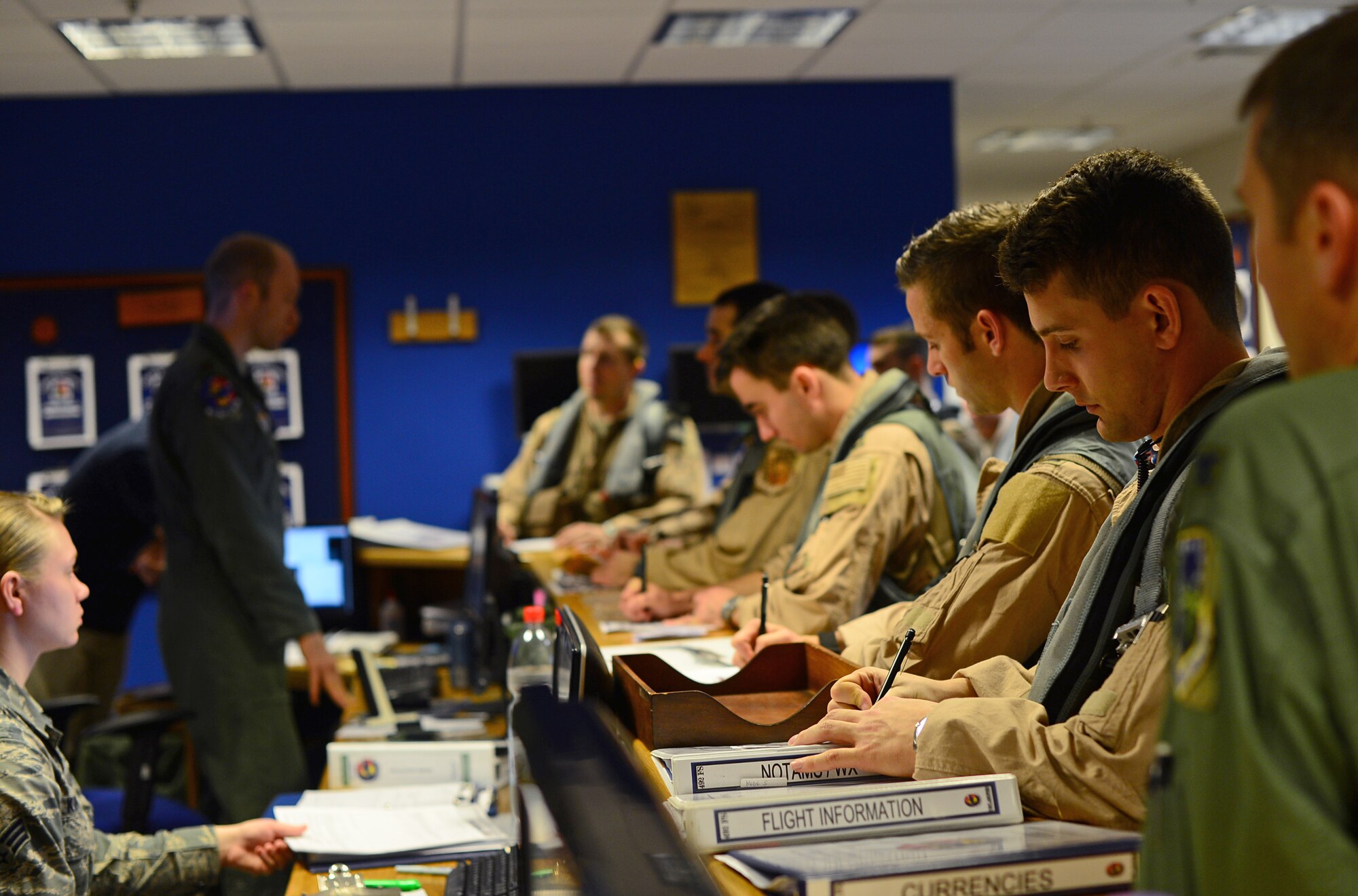 U.S. Air Force pilots attend a pre-flight briefing prior to departing for Turkey, Nov. 12, 2015. F-15E Strike Eagle aircraft from the 48th Fighter Wing deployed to Incirlik Air Base to support Operation Inherent Resolve operations in Iraq and Syria. (U.S. Air Force photo by Senior Airman Erin Trower/Released)