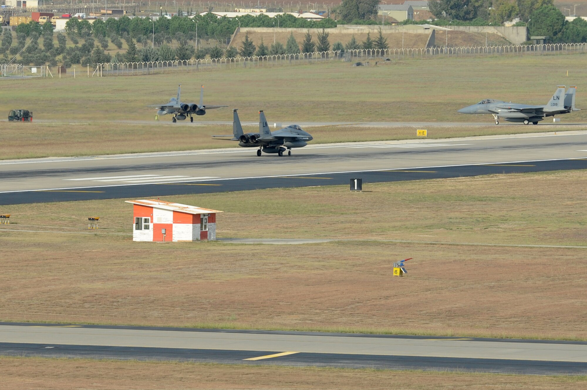 Three F-15C Eagles from the 493rd Fighter Squadron at RAF Lakenheath, UK, taxi the flightline at Incirlik Air Base, Turkey, Nov. 6, 2015. The six F-15Cs are deployed to Incirlik to conduct combat air patrols in Turkish air space. (U.S. Air Force photo by Tech. Sgt. Taylor Worley/Released)