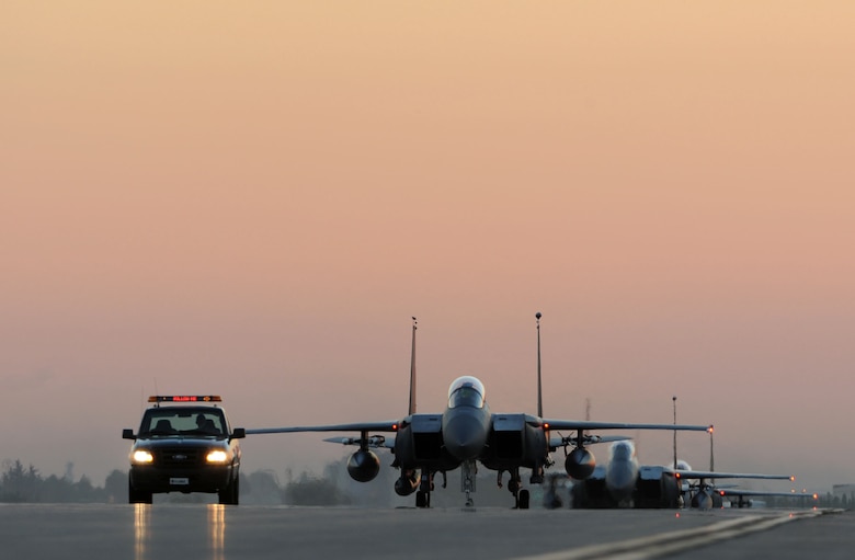 U.S. Air Force F-15E Strike Eagles taxi the runway after landing Nov. 12, 2015, at Incirlik Air Base, Turkey. The Strike Eagles deployed to Incirlik AB to conduct counter-ISIL missions in Iraq and Syria in support of Operation Inherent Resolve. This dual-role fighter designed to perform air-to-air and air-to-ground missions in all weather conditions. (U.S. Air Force photo by Tech. Sgt. Taylor Worley)