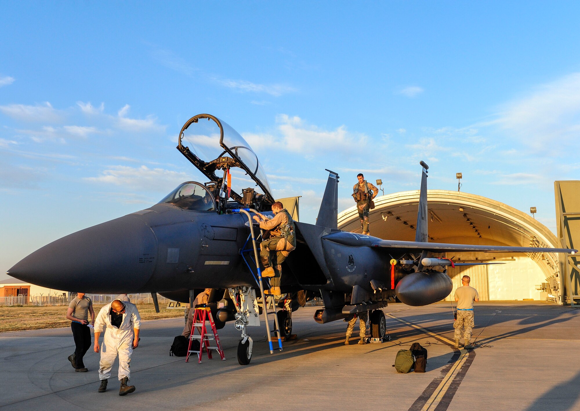 A U.S. Air Force pilot steps out of an F-15E Strike Eagle aircraft shortly after arriving at Incirlik Air Base, Turkey Nov. 12, 2015. Six F-15E Strike Eagles deployed to Incirlik AB from the 48th Fighter Wing, based at RAF Lakenheath, UK, in support of Operation Inherent Resolve and counter-ISIL missions in Iraq and Syria. This dual-role fighter jet is designed to perform air-to-air and air-to-ground missions in all weather conditions. (U.S. Air Force photo by Airman 1st Class Cory W. Bush/Released)