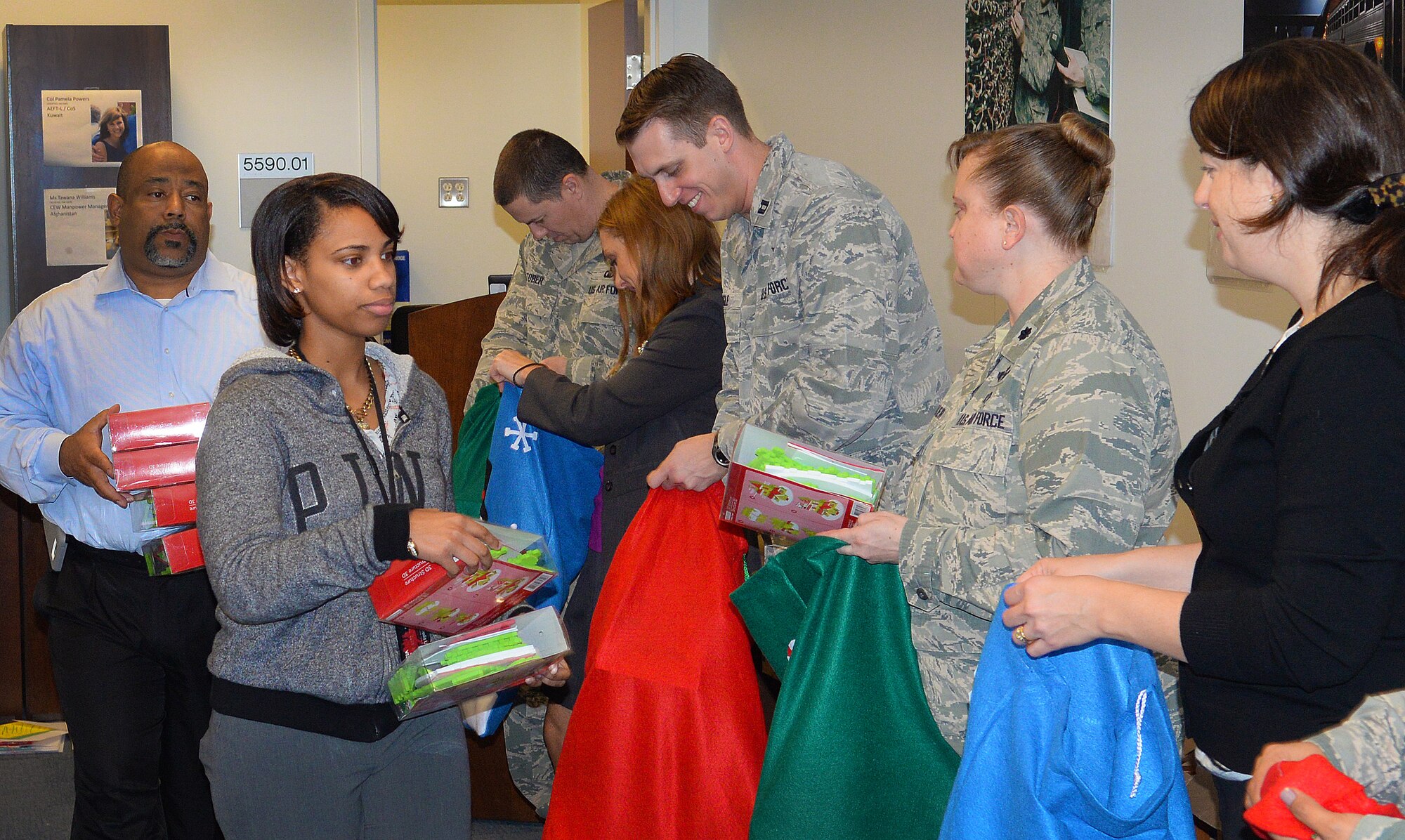 Air Force District of Washington volunteers packaged 25 care packages for AFDW deployed members November 12, 2015 on Joint Base Andrews, Md. The packages were filled with snacks and decorations to celebrate the holidays away from home. Since 2009, AFDW has sent 341 care packages to service members around the globe. (U.S. Air Force photo/Mr. Jim Lotz)