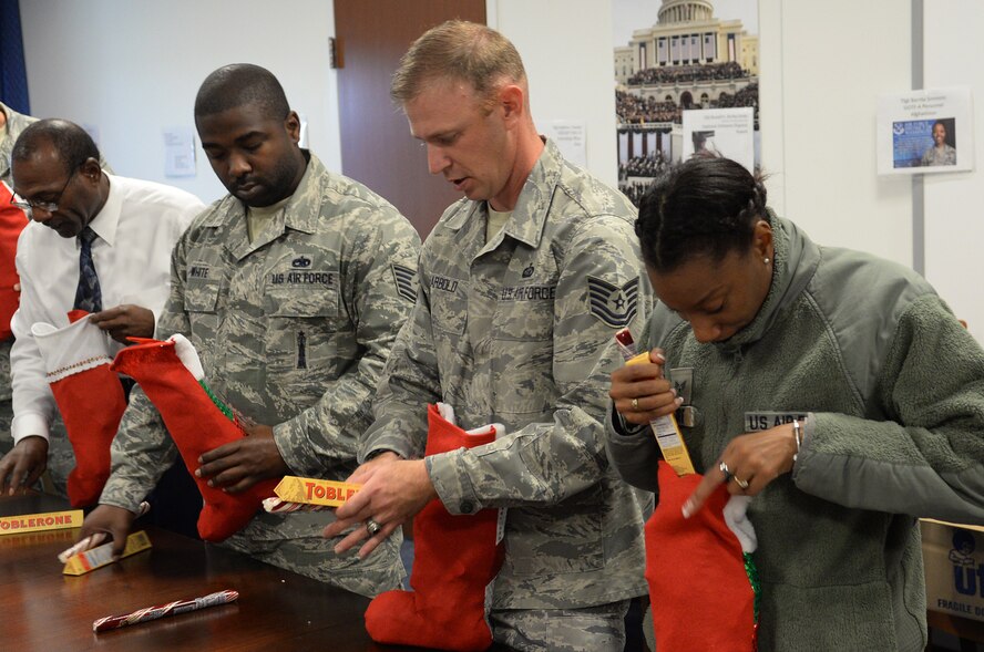 Air Force District of Washington volunteers packaged 25 care packages for AFDW deployed members November 12, 2015 on Joint Base Andrews, Md. The packages were filled with snacks and decorations to celebrate the holidays away from home. Since 2009, AFDW has sent 341 care packages to service members around the globe. (U.S. Air Force photo/Mr. Jim Lotz)