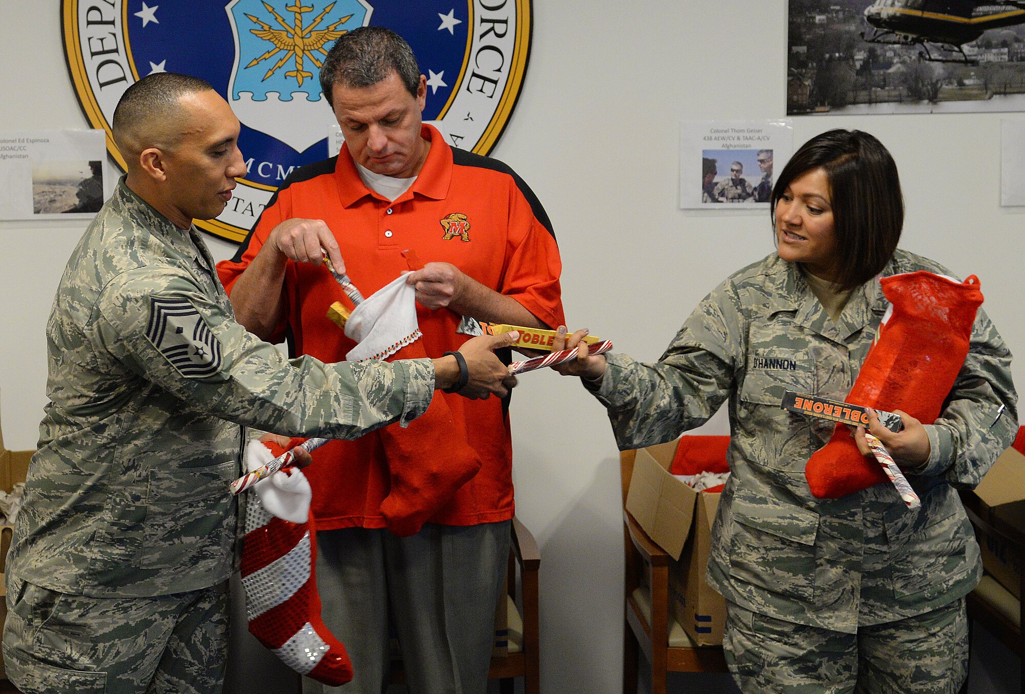 Air Force District of Washington volunteers packaged 25 care packages for AFDW deployed members November 12, 2015 on Joint Base Andrews, Md. The packages were filled with snacks and decorations to celebrate the holidays away from home. Since 2009, AFDW has sent 341 care packages to service members around the globe. (U.S. Air Force photo/Mr. Jim Lotz)