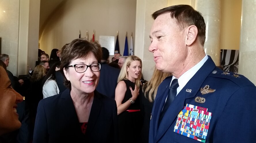 Air Force District of Washington Commander Maj. Gen. Darryl Burke speaks with Maine Sen. Susan Collins before the Veterans Day wreath laying ceremony at Arlington National Cemetery Nov. 11, 2015. (courtesy photo)