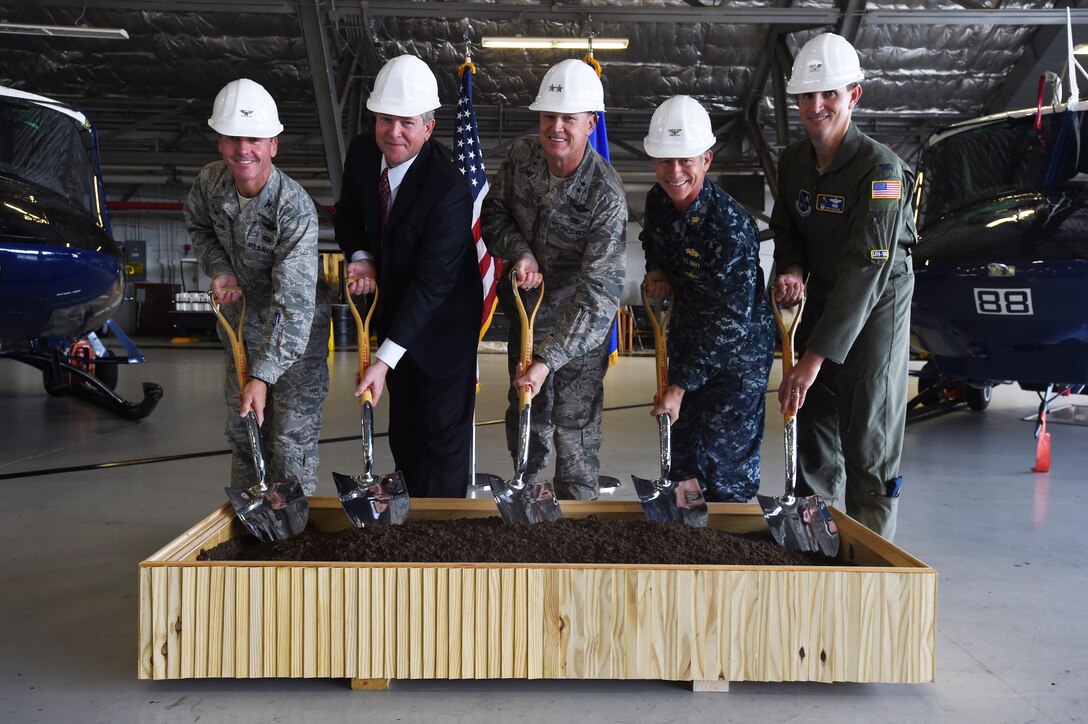 Team Andrews leadership pose during a ground breaking ceremony for the 811 Operations Group at Joint Base Andrews, Md., Nov. 12, 2015. The new facility will provide space for mission planning, briefing, training, flight simulation, operations and administration. (U.S. Air Force photo by Senior Airman Joshua R. M. Dewberry/Released)