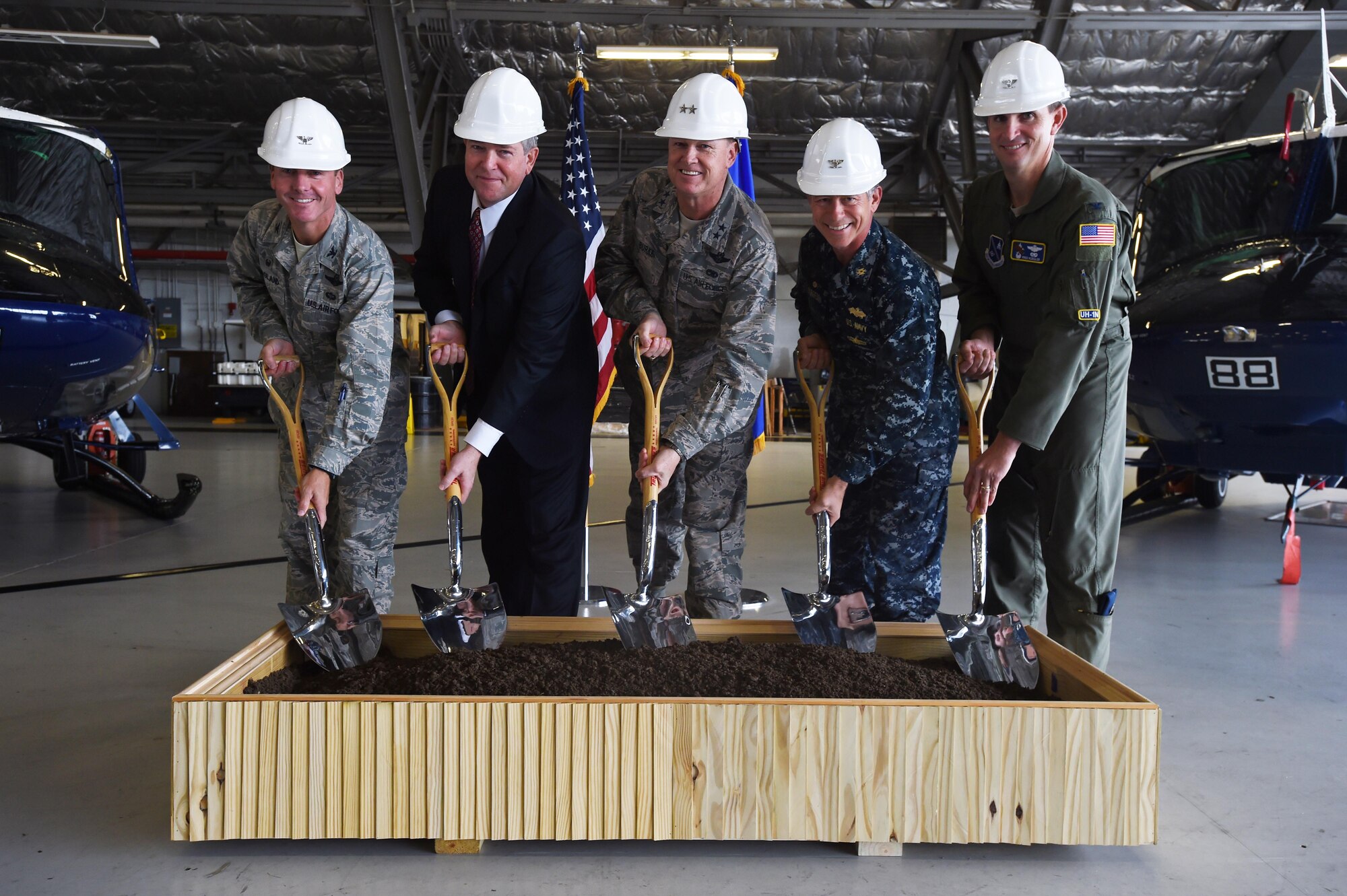 Team Andrews leadership pose during a ground breaking ceremony for the 811 Operations Group at Joint Base Andrews, Md., Nov. 12, 2015. The new facility will provide space for mission planning, briefing, training, flight simulation, operations and administration. (U.S. Air Force photo by Senior Airman Joshua R. M. Dewberry/Released)