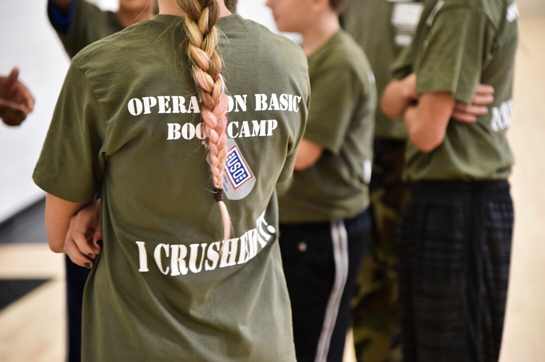Operation Basic Boot Camp, an event designed to help military children better understand and appreciate parental military service, was held on Joint Base Andrews, Md., Nov. 7, 2015. The event included physical training, a mock military in-processing station, basic drills and military knowledge classes, a survival class and capture the. (U.S. Air Force photo/ Airman 1st Class J.D. Maidens/ Released)