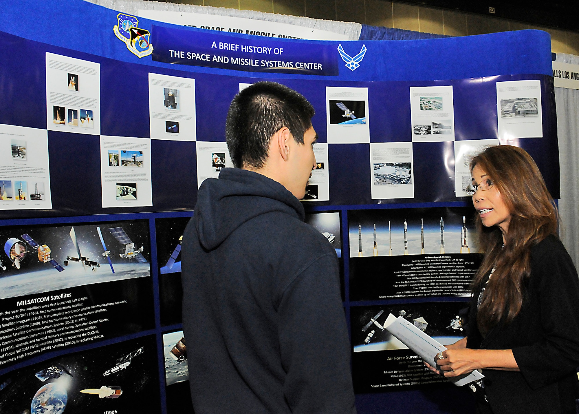 Van Choat, from the Space and Missile Systems Center's Contracting Directorate, discusses career opportunities with a Los Angeles Unified School District student during the L.A. Chamber of Commerce-sponsored career fair held Oct. 28-29 at the Los Angeles Convention Center. (U. S. Air Force photo/Joe Juarez Sr.)
