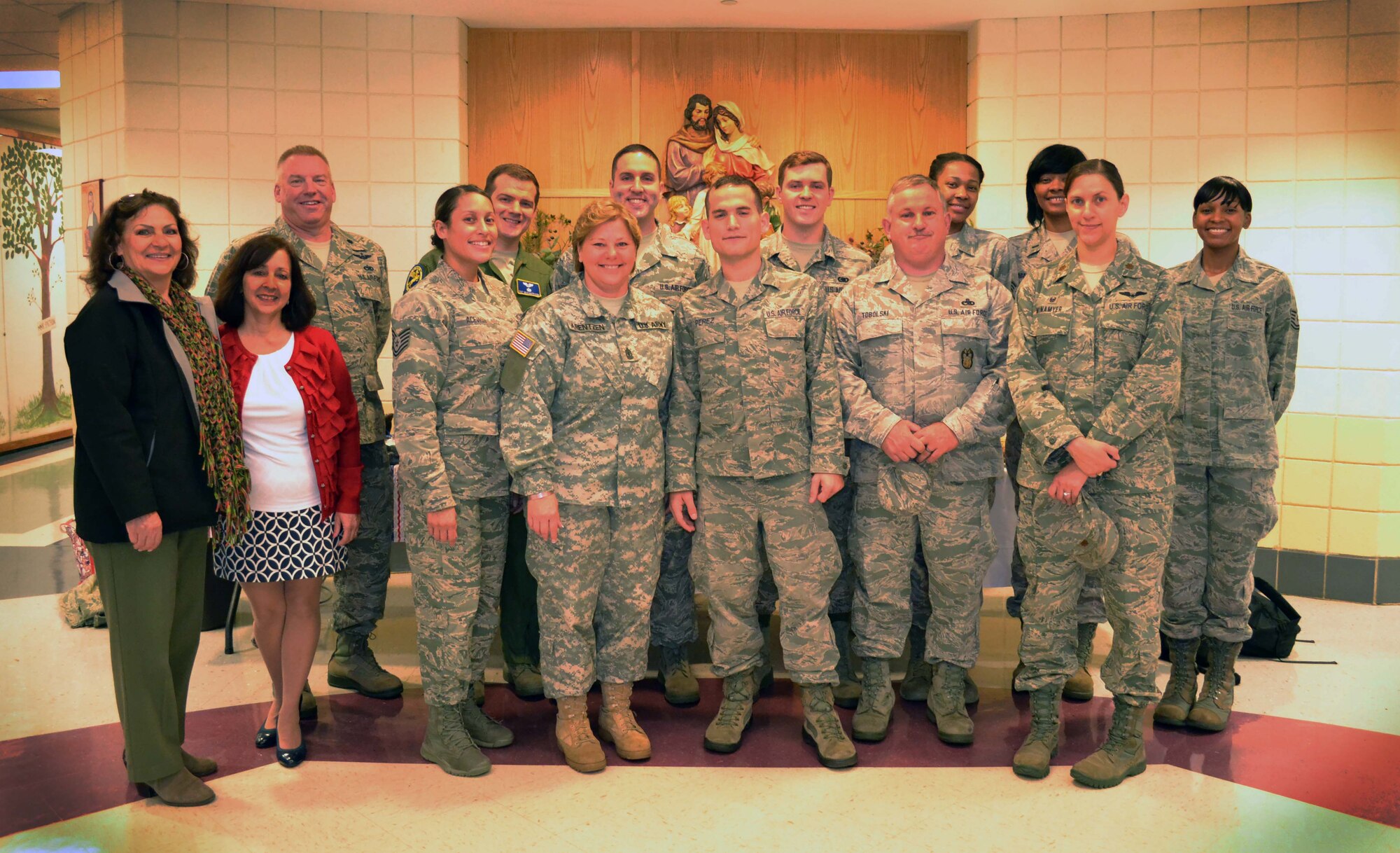 Members of the 111th Attack Wing at Horsham Air Guard Station, Pennsylvania, and volunteers with the Horsham Air Guard Station Airman & Family Readiness Center, stand for a group photo after participating in a character education program with students from Mary, Mother of the Redeemer Catholic School in North Wales, Pennsylvania, Nov. 12, 2015. 111th Attack Wing members and associated Wing civilian volunteers partnered with the school in an event intended help students develop into moral, civic and good-mannered community members. (U.S. Air National Guard photo by Tech. Sgt. Andria Allmond/Released)