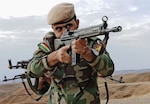 A Kurdish peshmerga soldier takes the lead during urban combat maneuvering training held near Irbil, Iraq. Supported by the Coalition, peshmerga fighters are working to cut ISIL's main line of communication between Raqqa and Mosul, Iraq. (U.S. Army photo by Spc. Tristan Bolden)