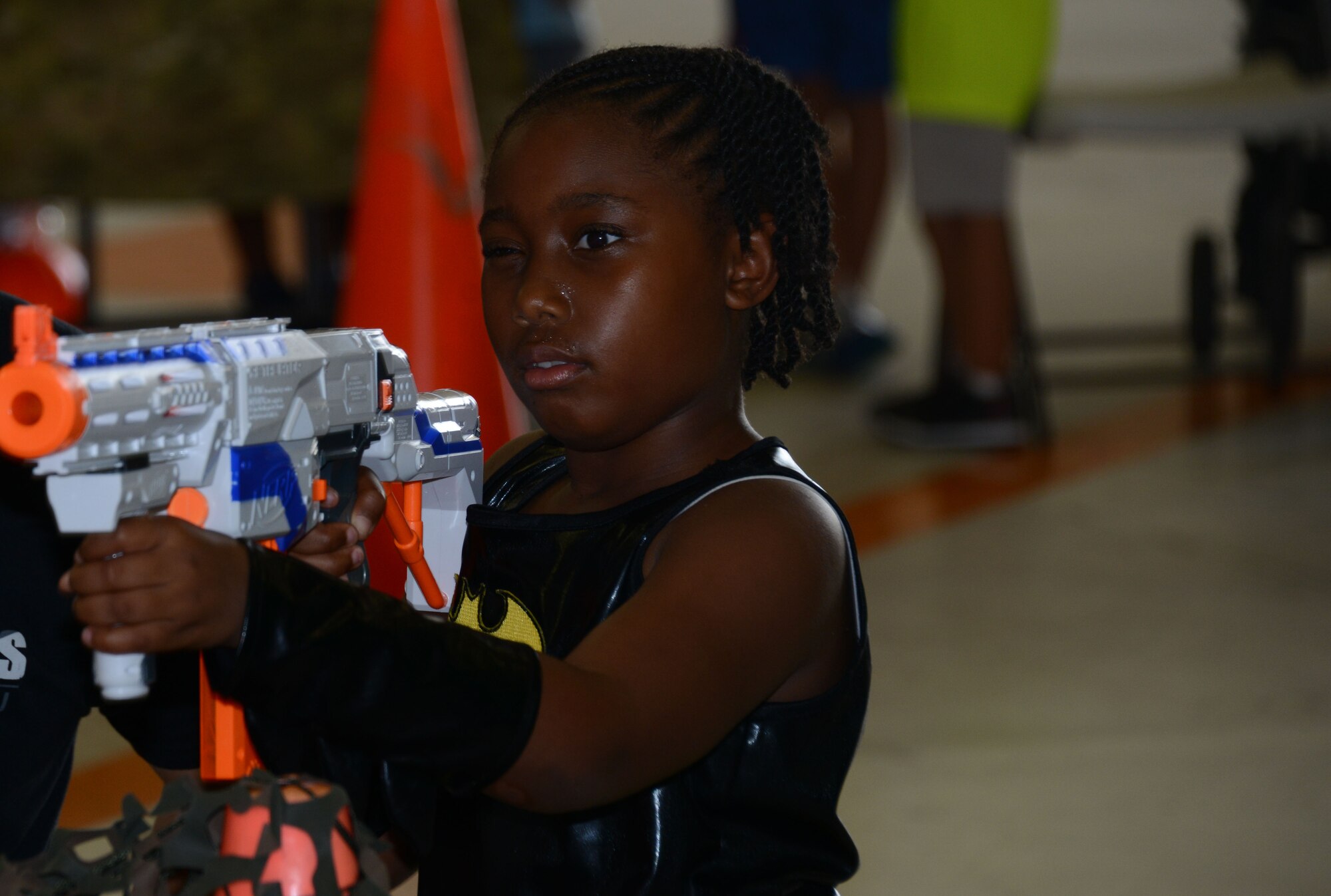 A child from the 353rd Special Operations Group takes aim at the target during the 353rd Special Operations Group Fall Festival held Oct. 31, 2015 at Kadena Air Base, Japan.  All five squadrons from the 353rd Special Operations Group came together set up booths with games, activities and food for the children of the 353rd Special Operations Group.  (U.S. Air Force photo by Tech. Sgt. Kristine Dreyer)