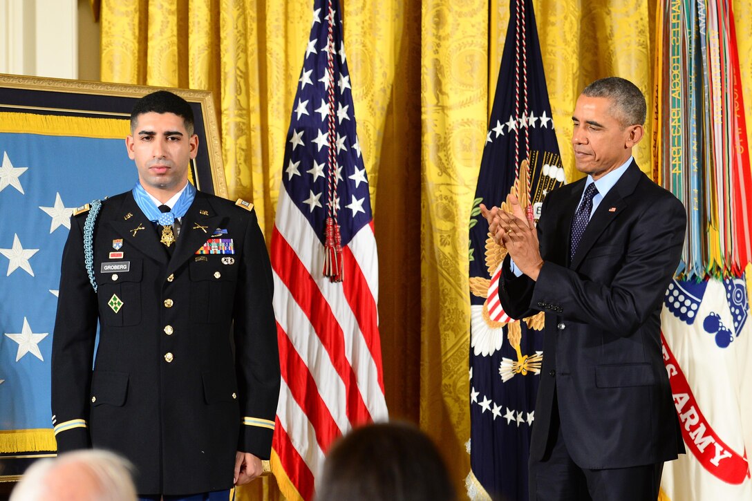 President Barack Obama applauds retired Army Capt. Florent A. Groberg after presenting him with the Medal of Honor at the White House, Nov. 12, 2015. U.S. Army photo by Eboni L. Everson-Myart