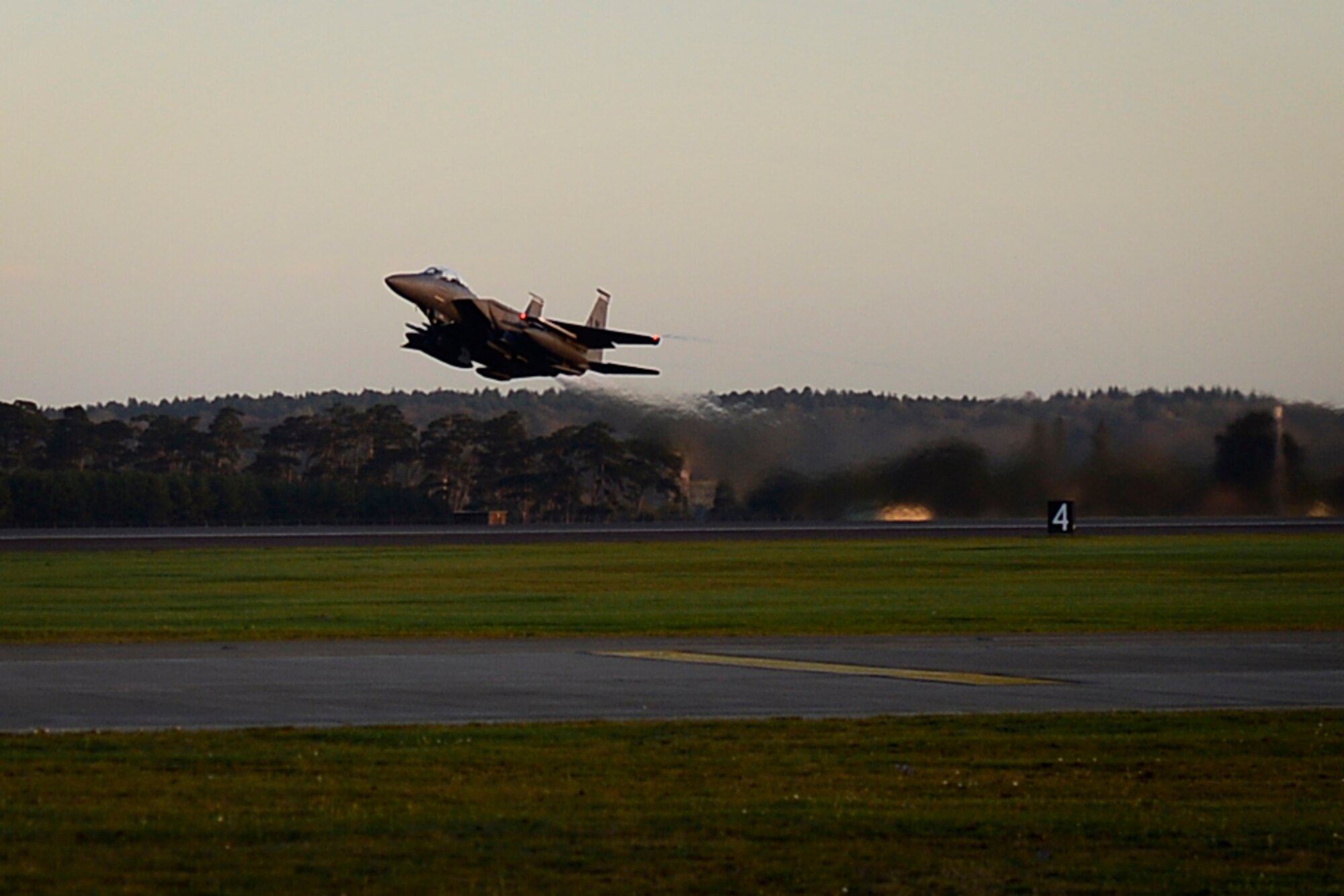 An F-15E Strike Eagle departs Royal Air Force Lakenheath, England, to support Operation Inherent Resolve Nov. 12, 2015. Aircraft from the 48th Fighter Wing deployed to Incirlik Air Base, Turkey, to conduct counter-Islamic State of Iraq and the Levant missions in Iraq and Syria. The dual-role fighter jet is designed to perform air-to-air and air-to-ground missions in all weather conditions. (U.S. Air Force photo/Airman 1st Class Erin R. Babis)