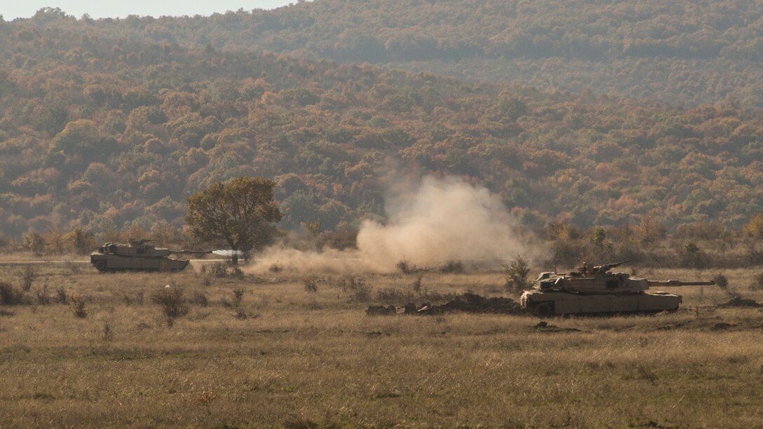 Bulgarian BMP-1s, U.S. M1A1 Abrams tanks and light-armored reconnaissance vehicles bound together toward an objective during the final exercise of Platinum Lion 16-1 at Novo Selo Training Area, Bulgaria, Nov. 7, 2015. Platinum Lion, the first multinational live-fire engagement in which the Combined Arms Company participated, is a NATO-led exercise designed to increase readiness and build partner capacity through realistic combat scenarios and objective-focused training. 