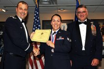 U.S. Air Force Col. Craig Drescher, 913th Airlift Group commander, poses for a photo with Senior Airman Jillian McCambridge, an air transportation apprentice assigned to the 96th Aero Port Squadron, during the Airman Leadership School graduation ceremony at Little Rock Air Force base, Ark., Oct. 22, 2015. McCambridge and her fellow graduates will soon become the Air Force’s newest noncommissioned officers. (U.S. Air Force photo by Senior Airman Harry Brexel/Released)