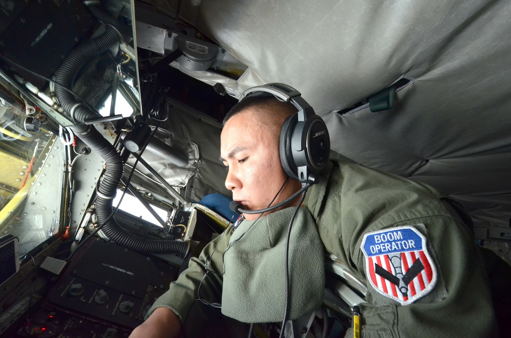 Staff Sgt. Kevin Gimenez, a KC-135 Stratotanker boom operator assigned to the Arizona Air National Guard, prepares to refuel a NATO E-3A Sentry over northern Germany during a training mission, Nov. 10, 2015. Airmen from the 161st Air Refueling Wing based in Phoenix are supporting aircrew training operations Nov. 9-20 at NATO Air Base Geilenkirchen, Germany. 