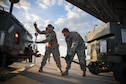 Master Sgts. John Brownell and Neil Allison of the 158th Fighter Wing unload cargo from a C-17 Globemaster III at Burlington International Airport, Vt., Nov. 3, 2015. This was the final plane to return from the theater support package the Vermont Air National Guard supported. (U.S. Air National Guard photo/Airman 1st Class Jeffrey Tatro)