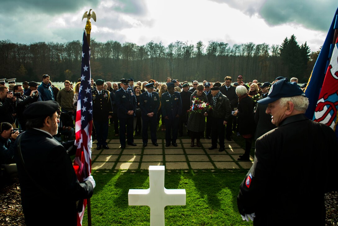 U.S. and European veterans pay tribute at the grave of U.S. Army Gen. George Patton after a wreath-laying ceremony at the Luxembourg American Cemetery and Memorial in Hamm, Luxembourg, Nov. 11, 2015. Helen Patton, chairman of the Patton Foundation and Patton's granddaughter, led the tribute to her grandfather and presented medals to the veterans who served with him. (U.S. Air Force photo/Airman 1st Class Timothy Kim)