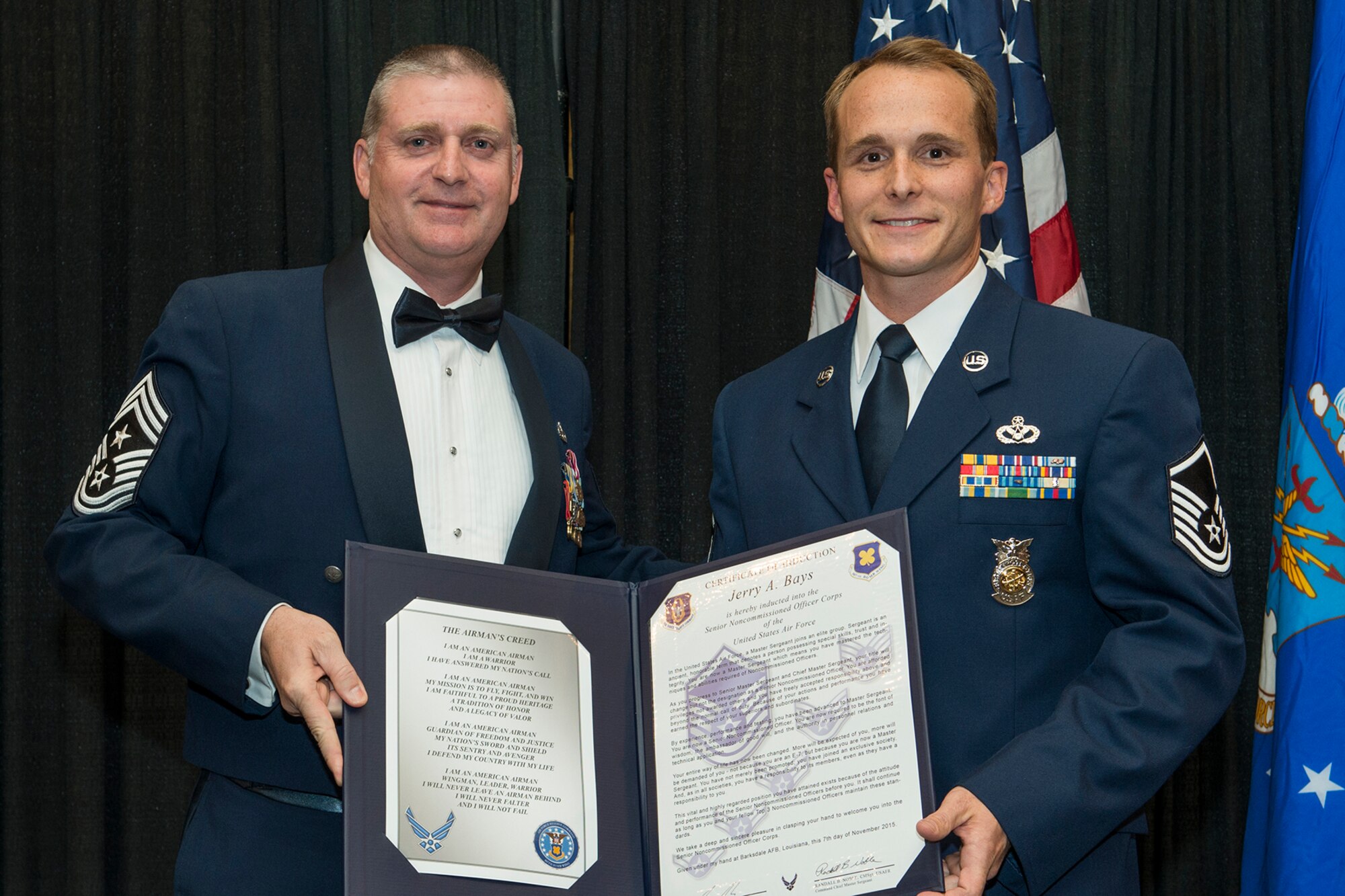 U.S. Air Force Master Sgt. Jerry Bays is presented the Certificate of Induction during a ceremony on Nov. 7, 2015, Shreveport, La. The 307th Bomb Wing Senior Noncommissioned Officer Induction Ceremony is an annual event held to recognize Airmen who were recently promoted to the rank of Master Sergeant. (U.S. Air Force photo by Master Sgt. Greg Steele/Released)