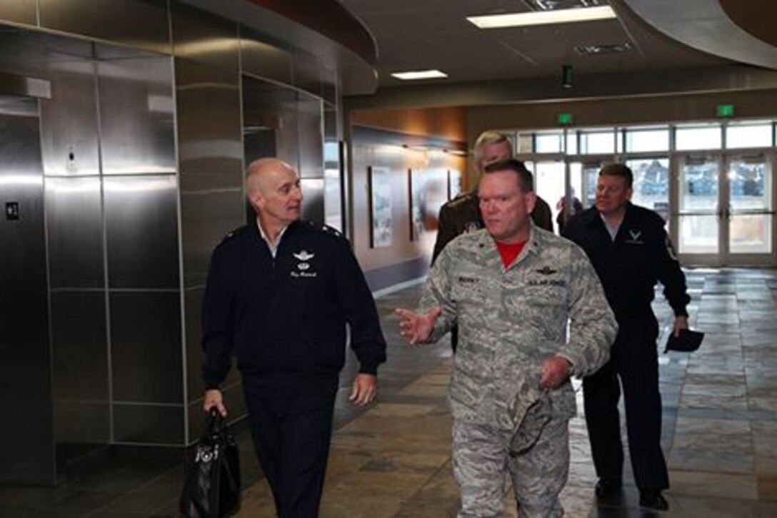 Maj. Gen. Garrett Harencak, commander, Air Force Recruiting Service, Joint Base San Antonio-Randolph, Texas, and Craig Ritza, director, Air Force Personnel Operations Activity director, Joint Base San Antonio - Randolph, Texas, are greeted by Brig. Gen. Samuel “Bo” Mahaney, Air Reserve Personnel Center commander, during their visit Nov. 13, 2015, to ARPC on Buckley Air Force Base, Colo. (U.S. Air Force photo/Quinn Jacobson)