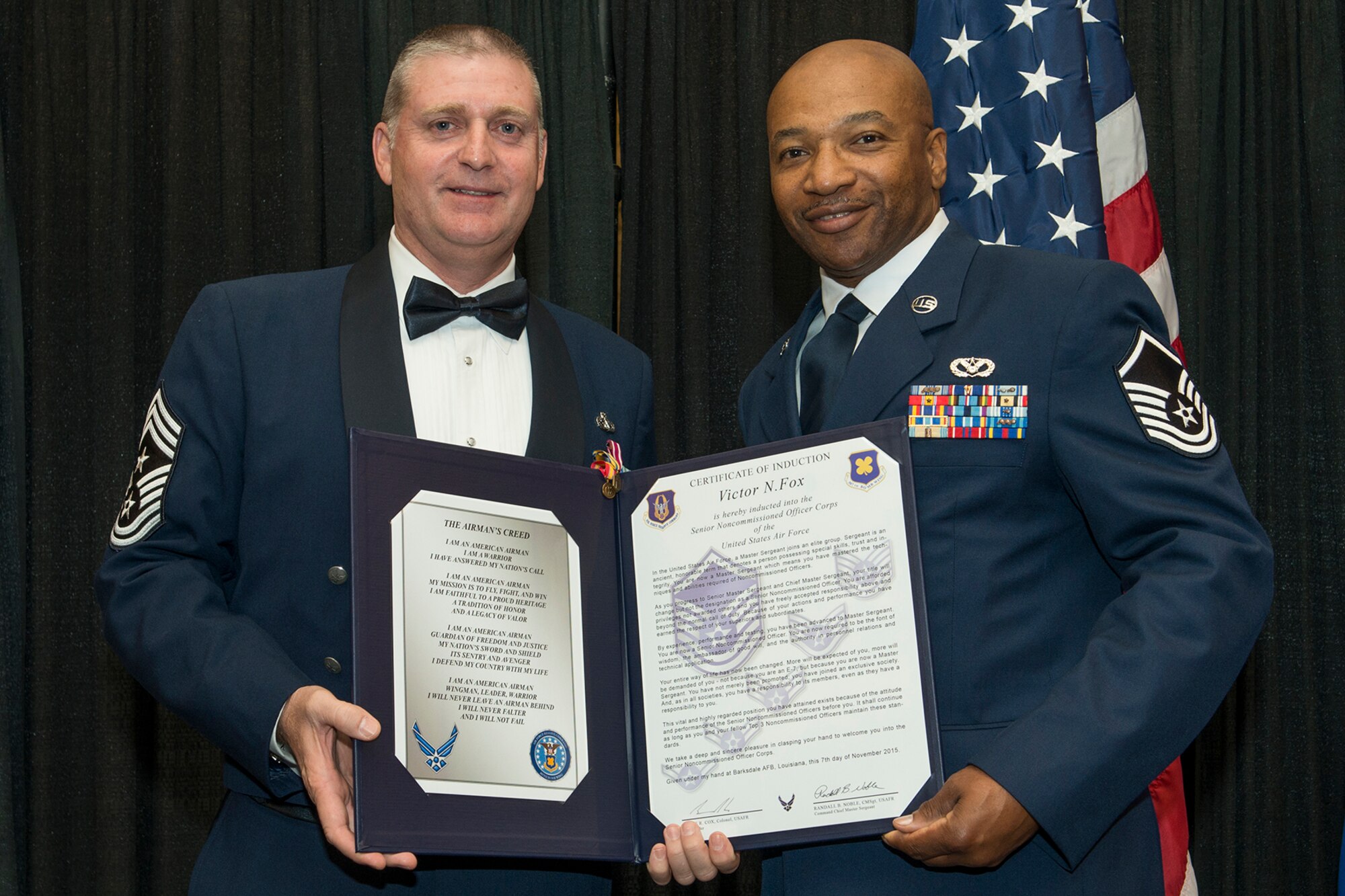 U.S. Air Force Master Sgt. Victor Fox is presented the Certificate of Induction during a ceremony on Nov. 7, 2015, Shreveport, La. The 307th Bomb Wing Senior Noncommissioned Officer Induction Ceremony is an annual event held to recognize Airmen who were recently promoted to the rank of Master Sergeant. (U.S. Air Force photo by Master Sgt. Greg Steele/Released)