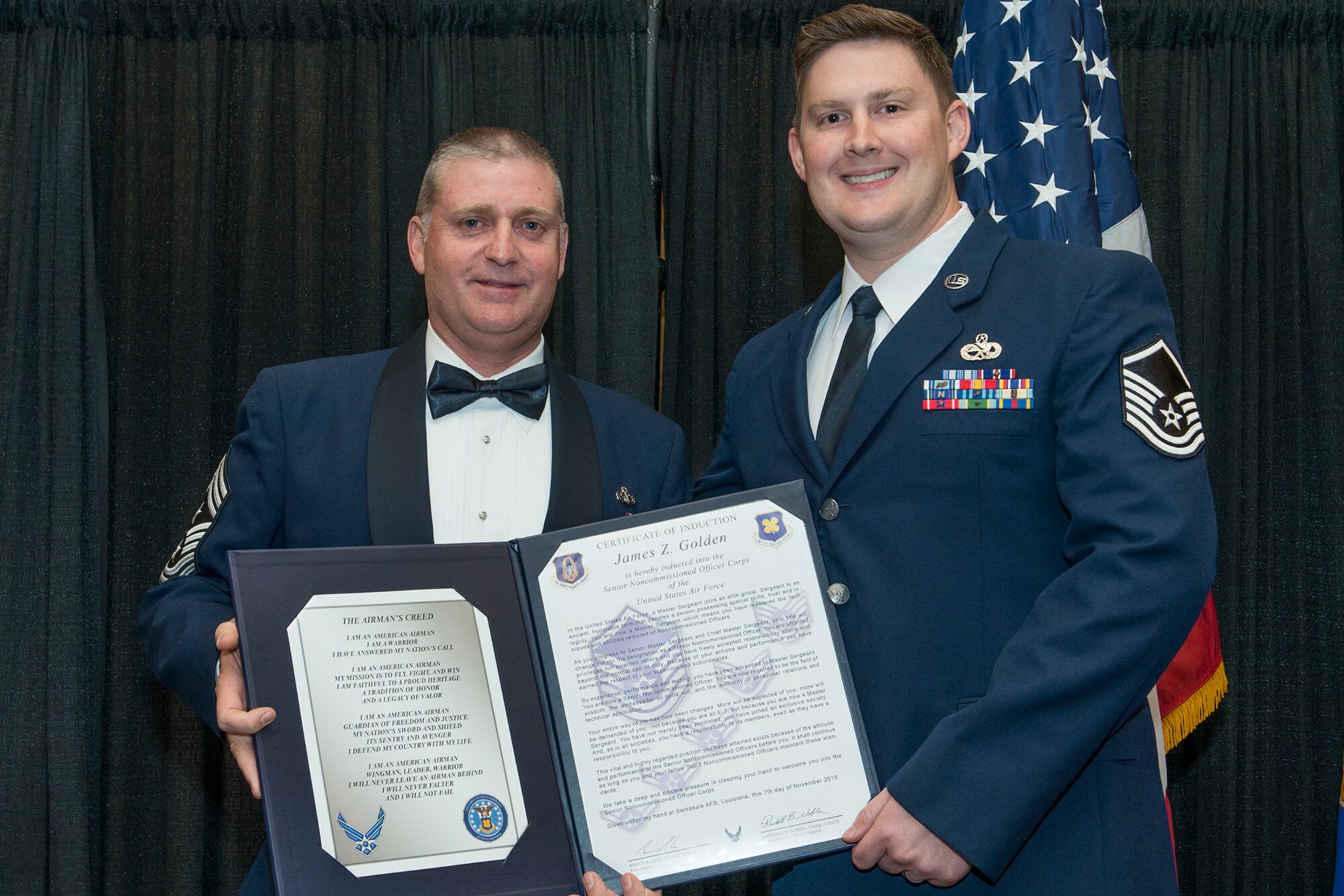 U.S. Air Force Master Sgt. James Golden is presented the Certificate of Induction during a ceremony on Nov. 7, 2015, Shreveport, La. The 307th Bomb Wing Senior Noncommissioned Officer Induction Ceremony is an annual event held to recognize Airmen who were recently promoted to the rank of Master Sergeant. (U.S. Air Force photo by Master Sgt. Greg Steele/Released)